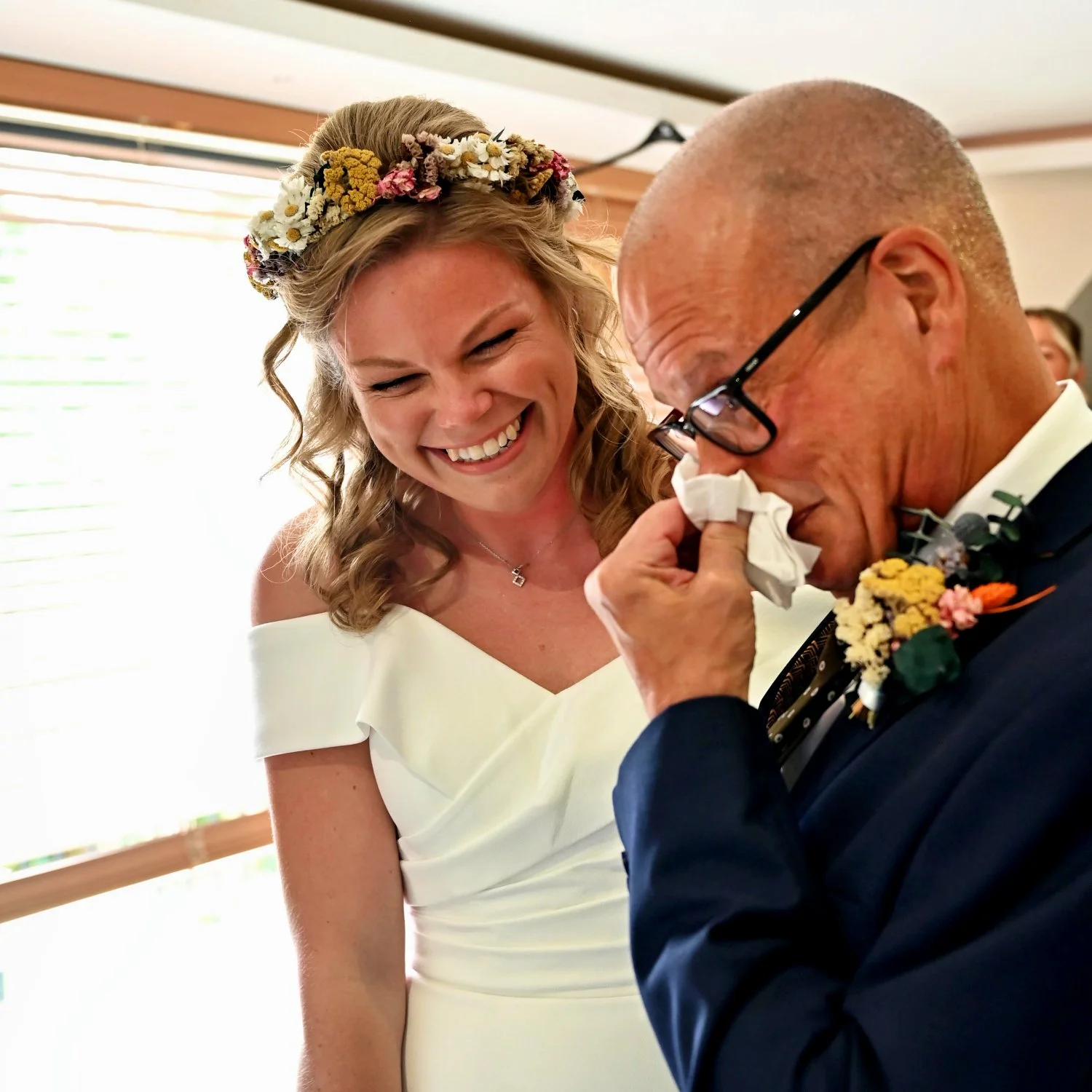 Father of the bride overcome with emotion wiping away tears as his daughter laughs lovingly beside him — candid father daughter wedding moment captured by Tasha Boorman, Nottinghamshire wedding photographer