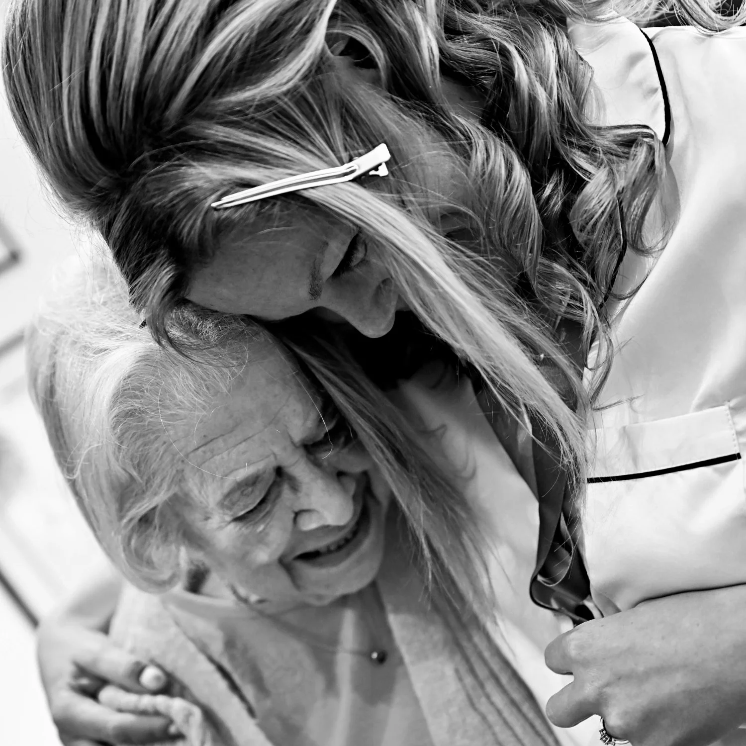 Bride sharing a deeply emotional embrace with her grandmother on her wedding morning — intimate candid documentary wedding photography by Tasha Boorman, Nottinghamshire wedding photographer