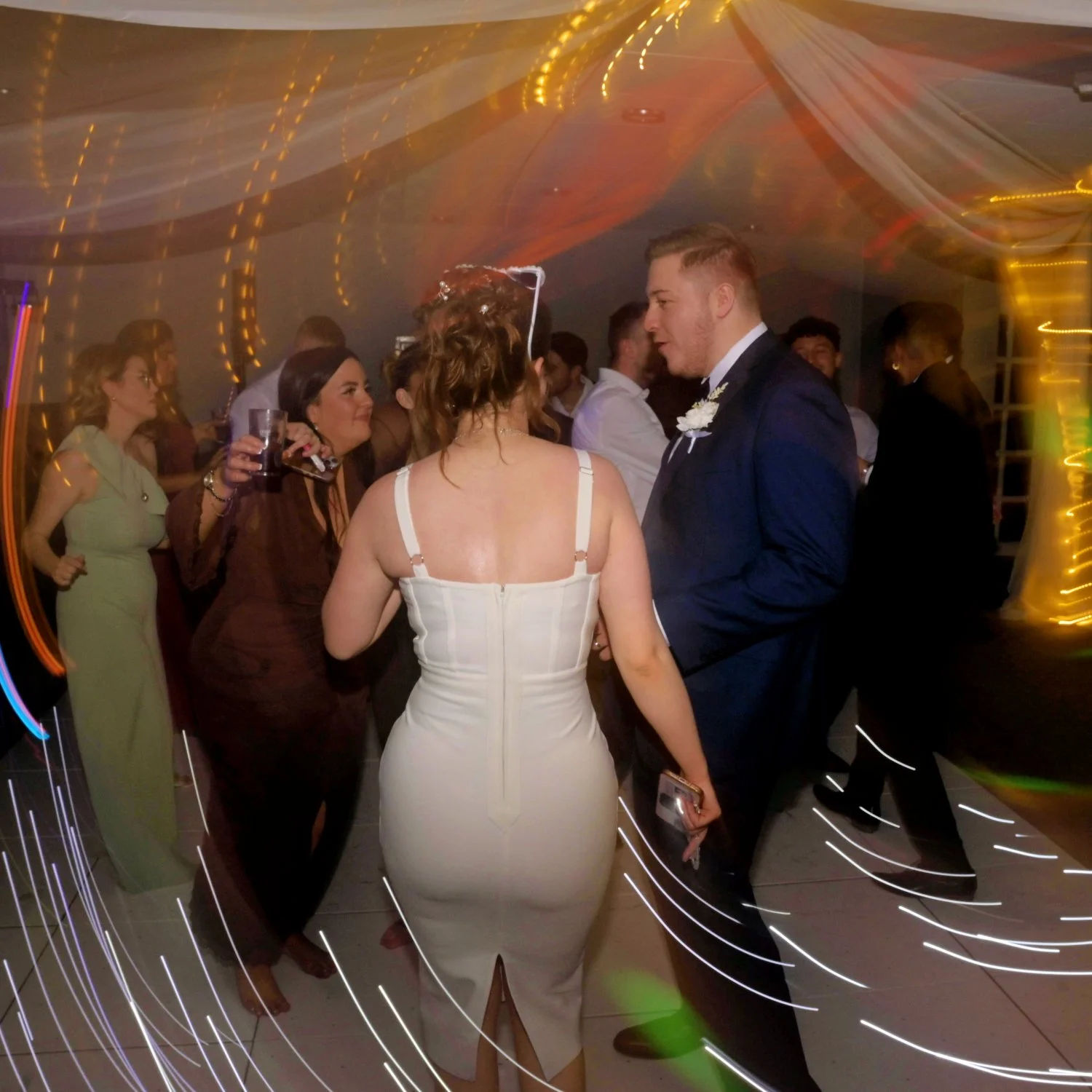 Bride and groom dancing at wedding reception with creative light trail photography, atmospheric evening reception, Quorne Grange Hotel Loughborough Leicestershire wedding photographer