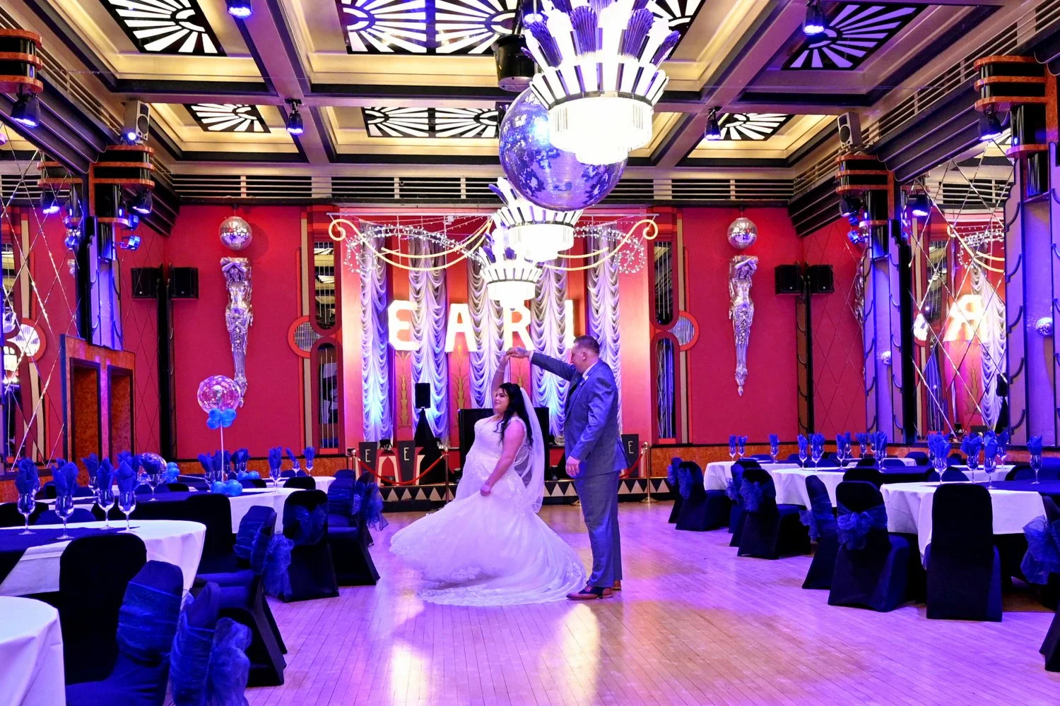 Bride and groom sharing a quiet first dance moment alone in the stunning art deco ballroom at The Earl of Doncaster before guests enter — wedding photography by Tasha Boorman, Doncaster wedding photographer
