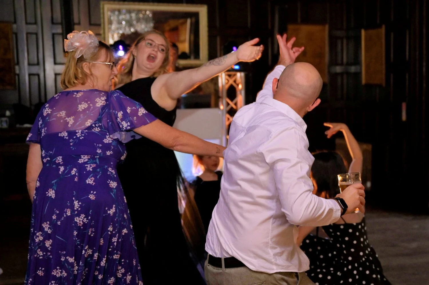 Wedding guests letting loose on the dancefloor during the evening reception — candid fun documentary wedding photography by Tasha Boorman, Nottinghamshire wedding photographer