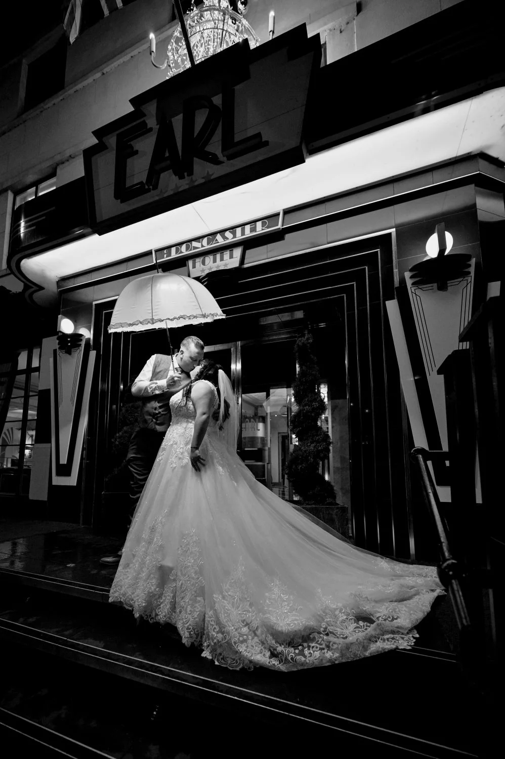 Couple wedding portrait outside The Earl of Doncaster hotel in low light, wedding photography by Tasha Boorman, Doncaster wedding photographer