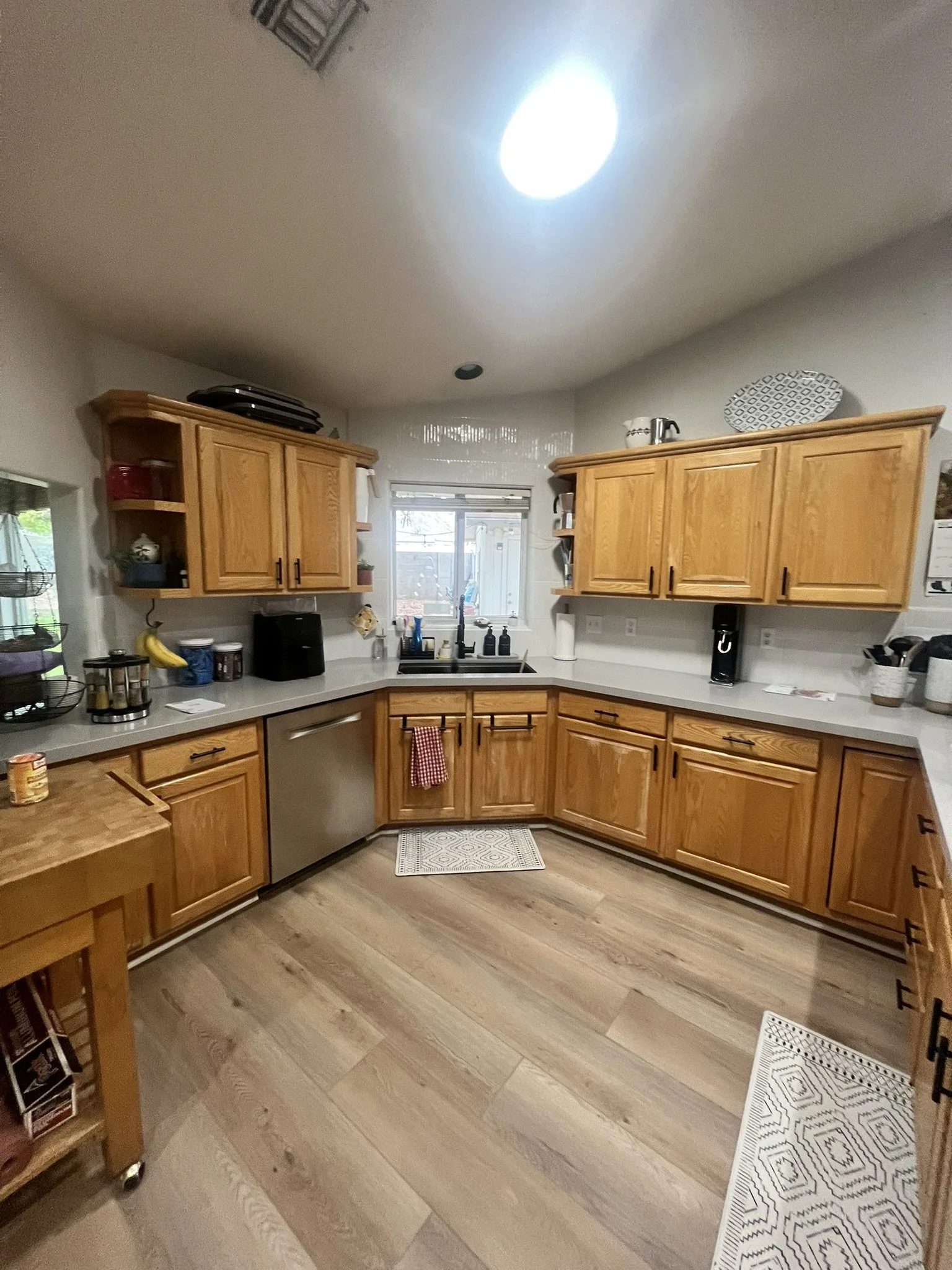 #L    Before-Kitchen with wooden cabinets get refinished.