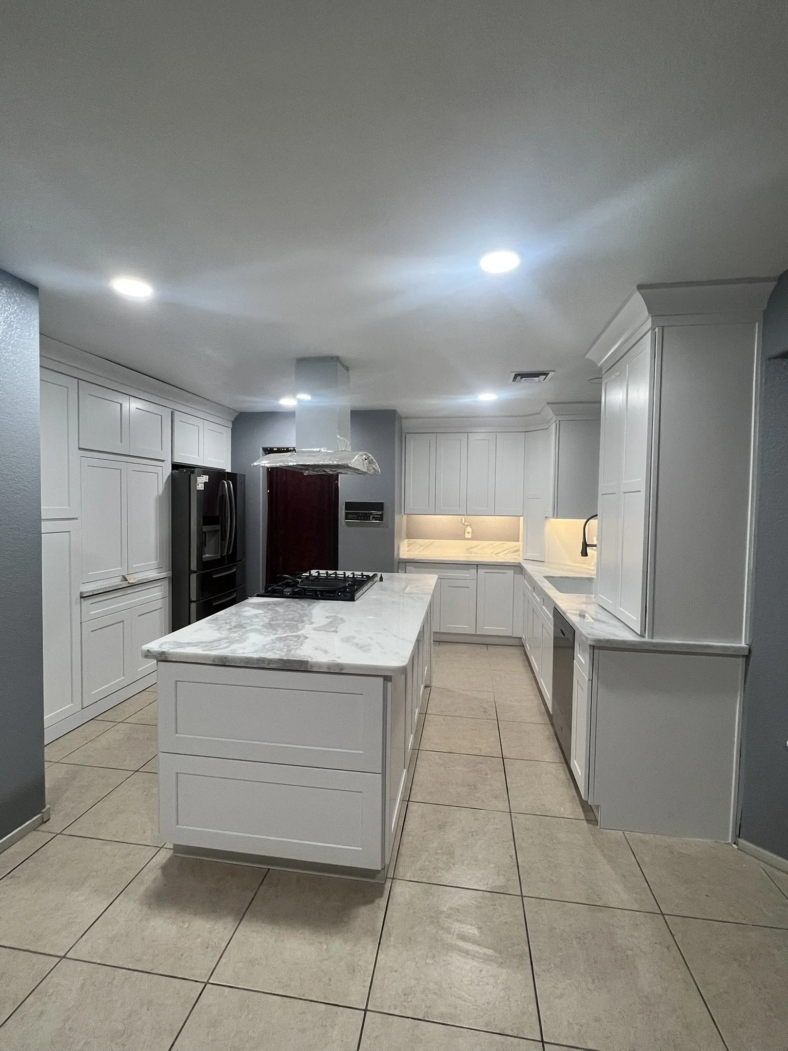 #F     After  This kitchen has been transformed with new cabinets, countertops, and a refreshing new color for the walls.