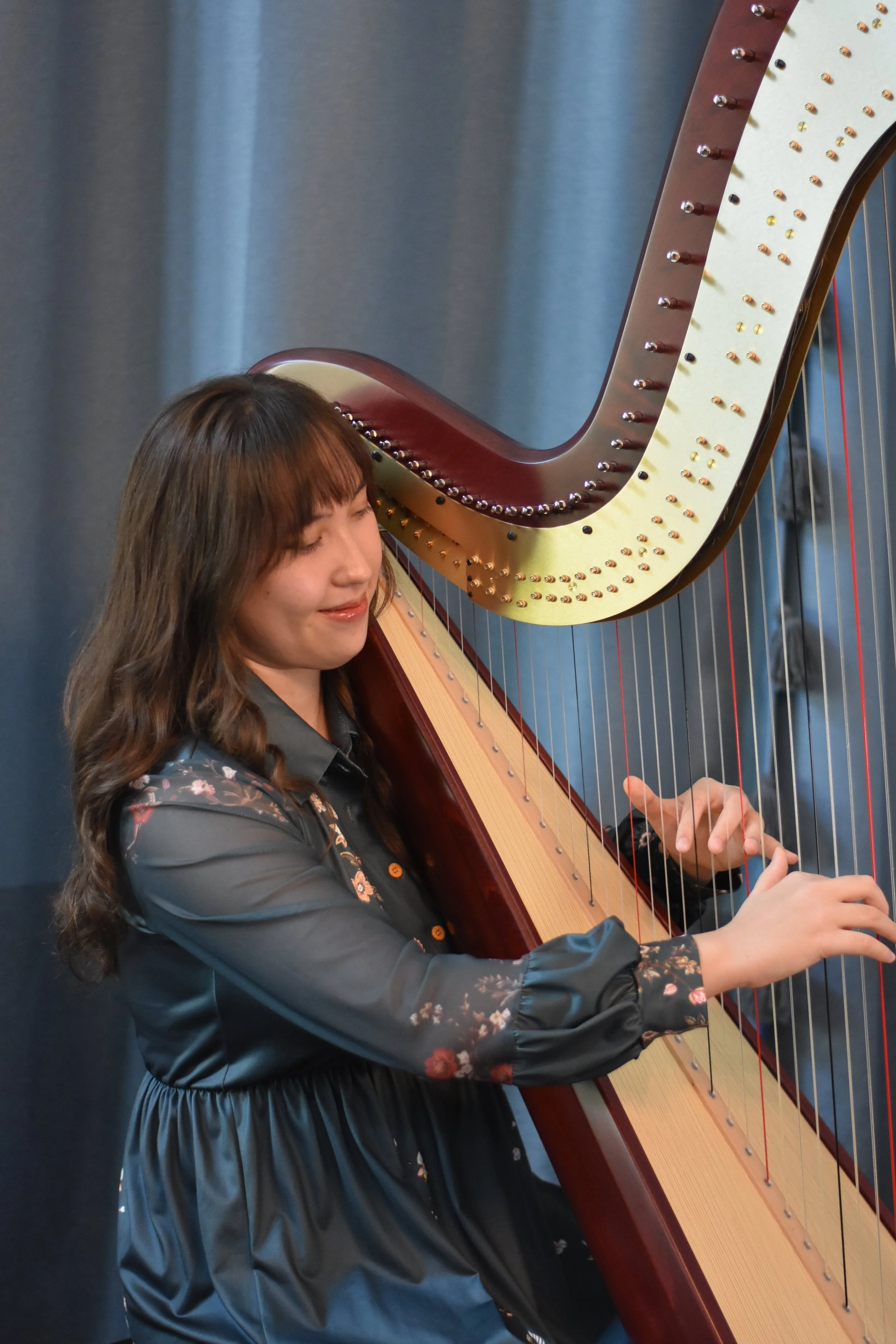 Hannah playing the harp