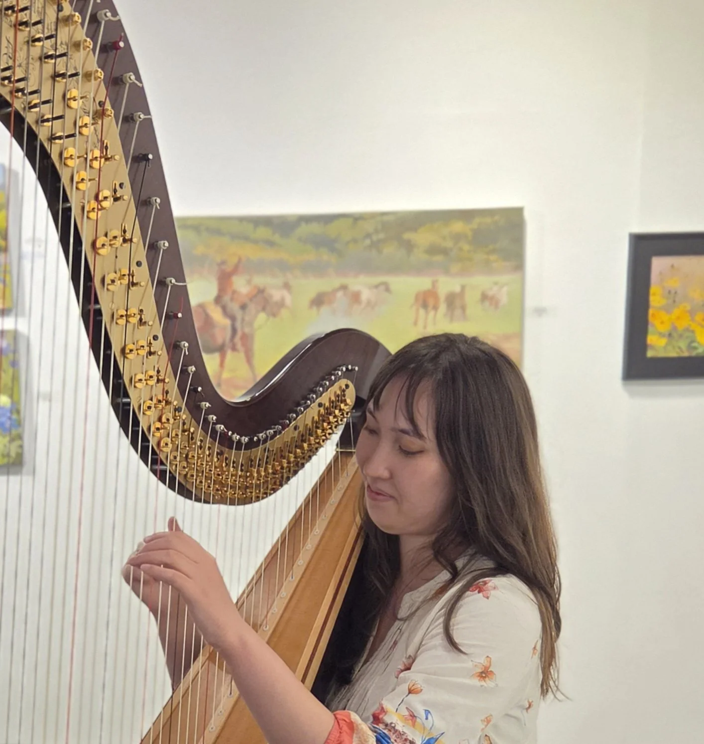 Hannah playing the harp