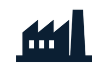 Silhouette of a factory building with a tall smokestack