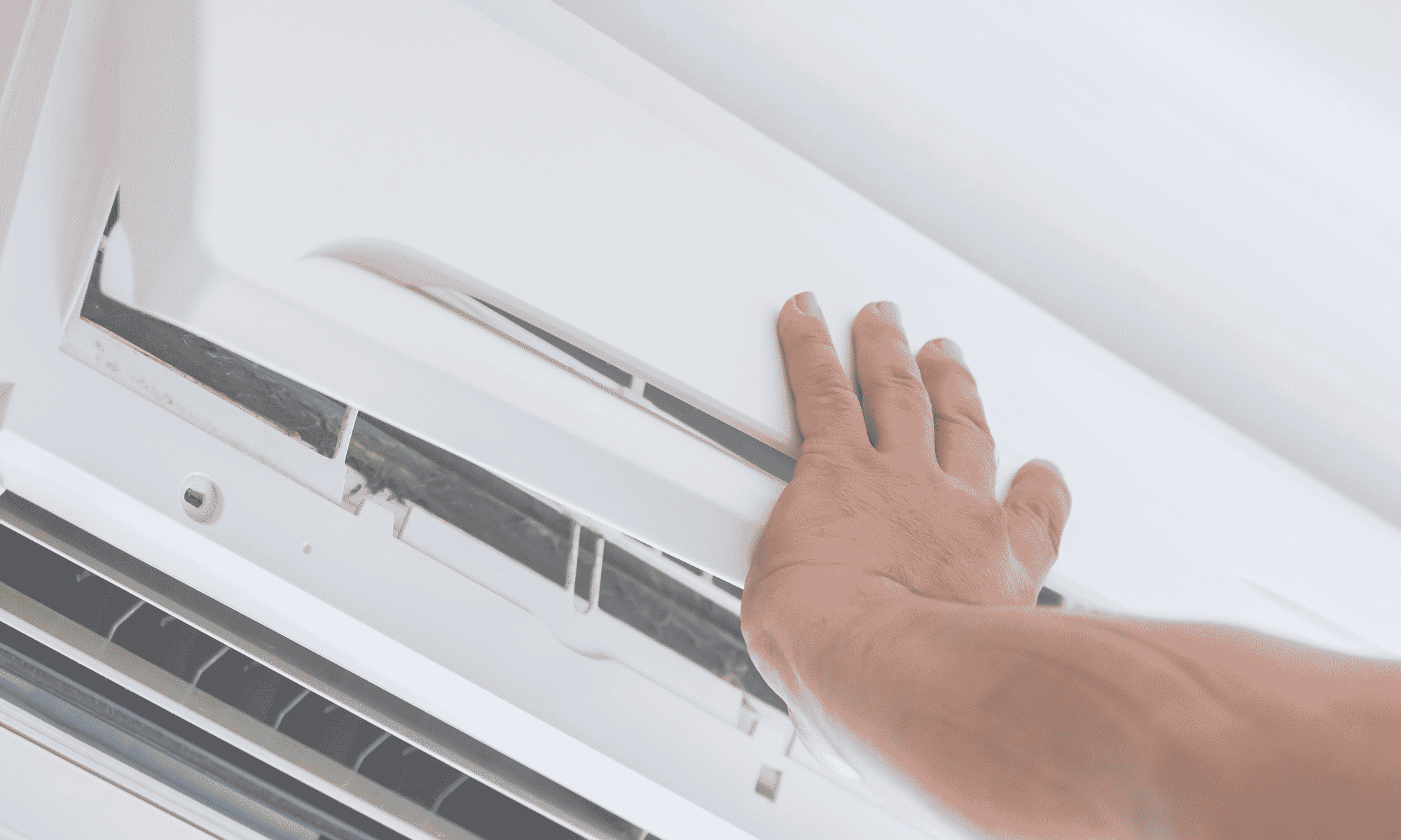 Close-up of a person's hand opening a white server rack door in a data center.