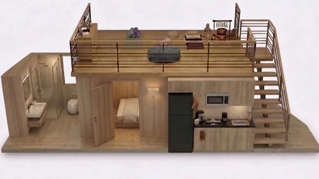 Inside the geodesic dome you will find an custom built interior module with a loft bedroom, kitchen area, bathroom, and staircase.