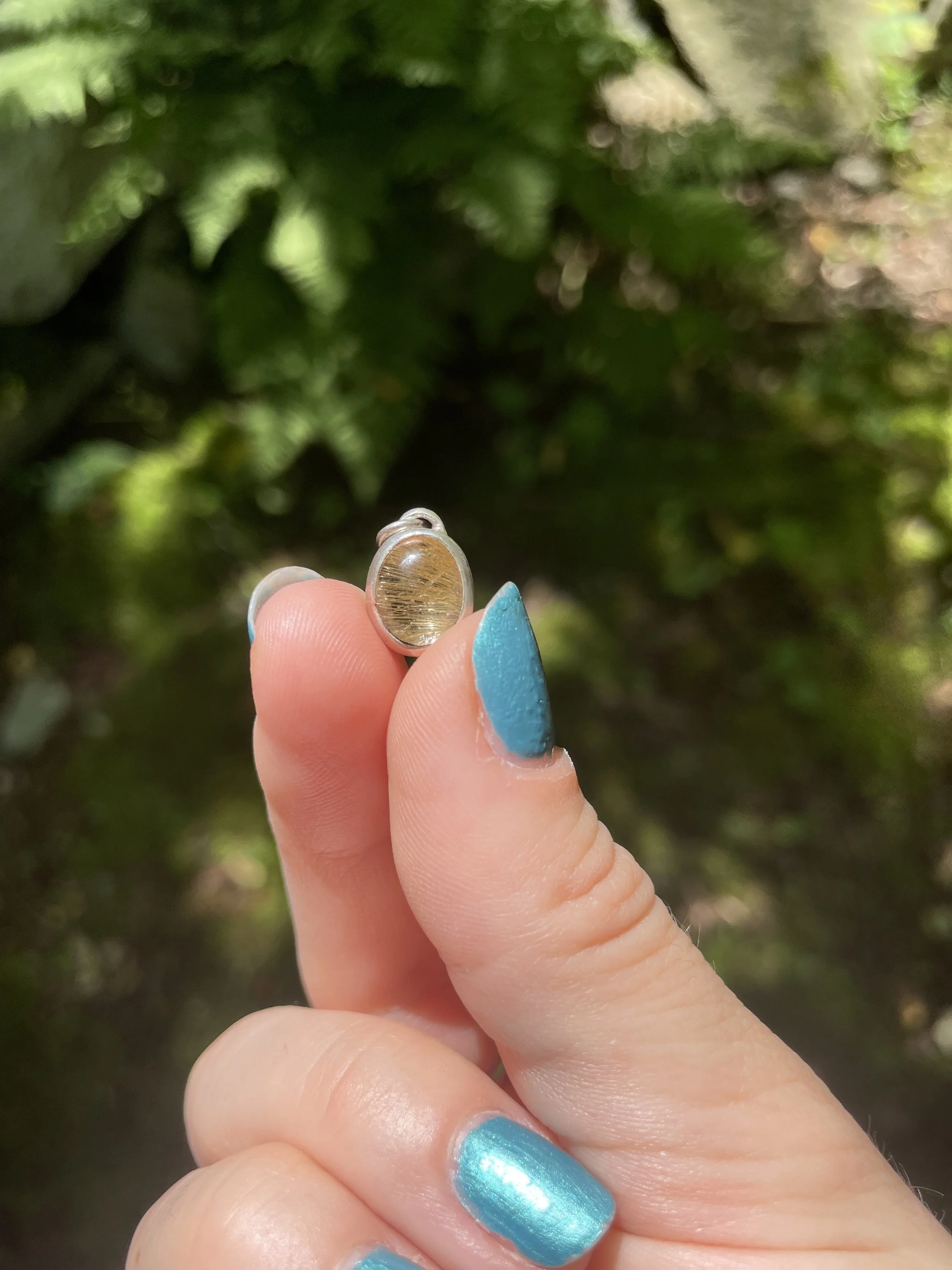 sterling silver step bezel, rutilated quartz cabochon
