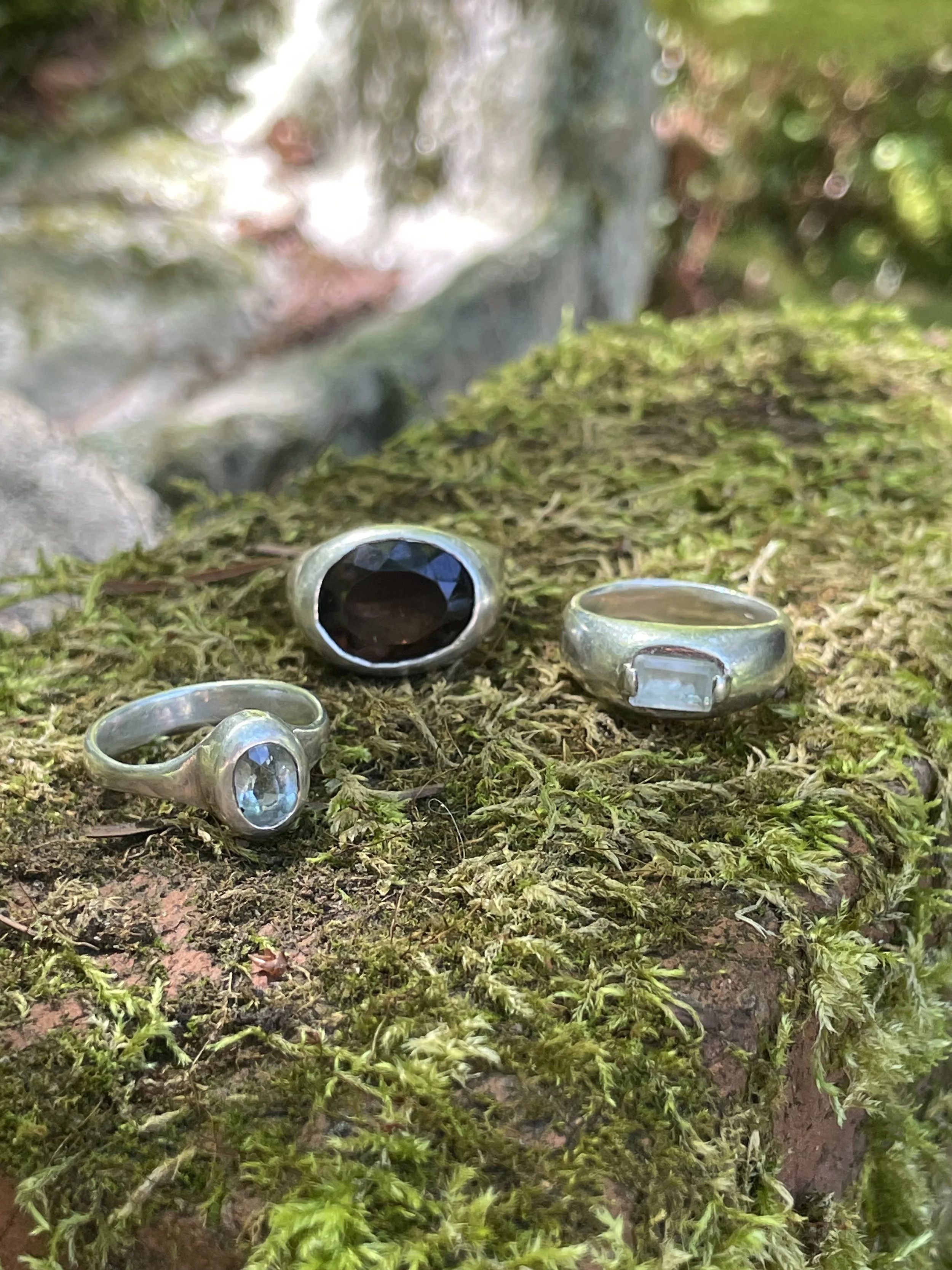 1) sterling silver, oval cut aquamarine
2) sterling silver, oval cut smoky quartz
3) sterling silver, aquamarine baguette