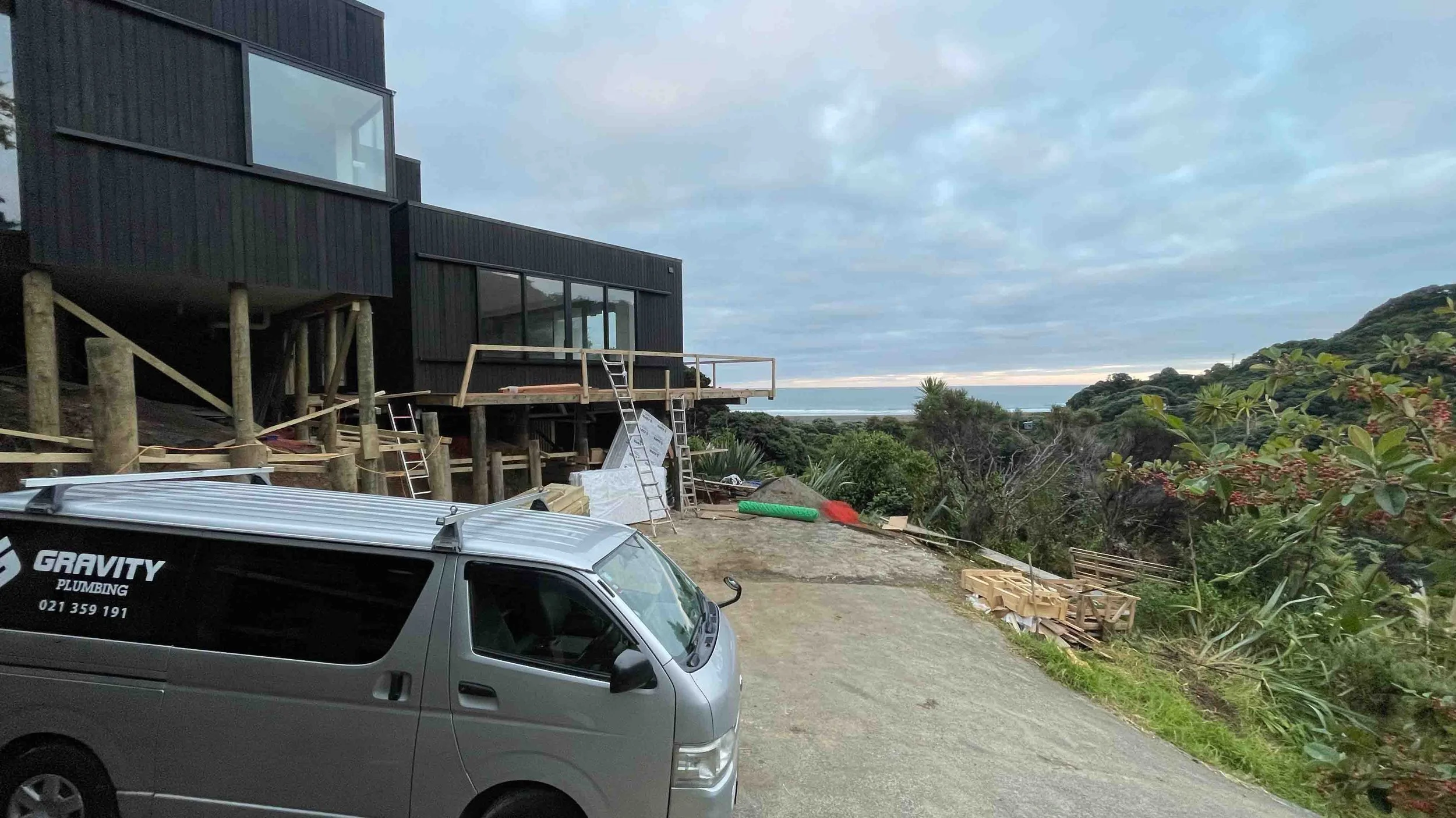 gravity-plumbing-van-parked-outside-new-build-plumbing-project
