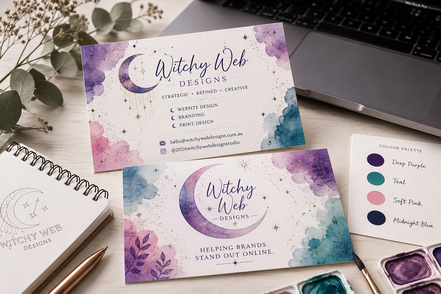 Business cards for 'Witchy Web Designs' with watercolor galaxy backgrounds, one with a purple and pink theme, the other with purple and blue, featuring moon and star illustrations, along with contact info and branding services listed.