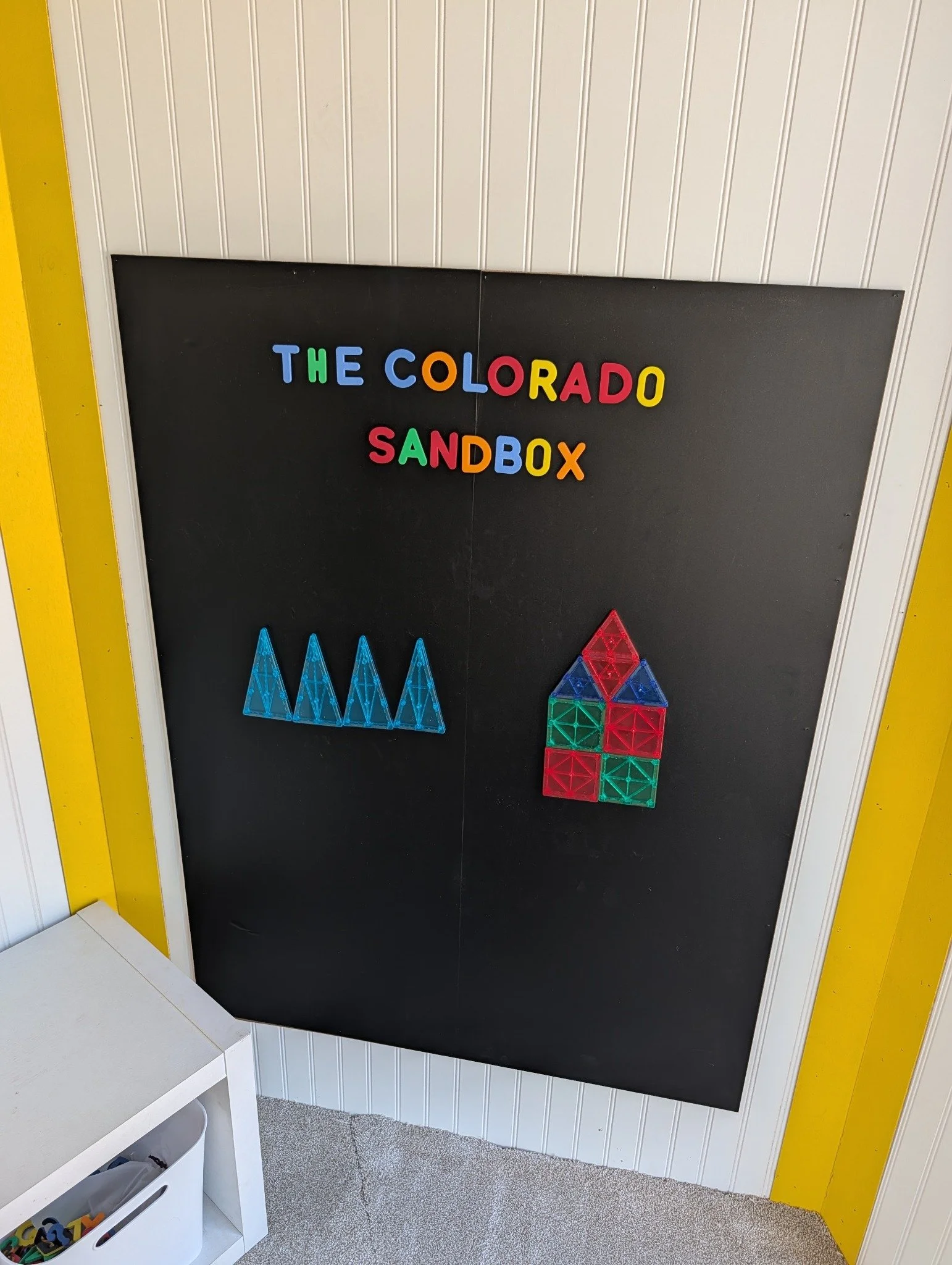 Magnetic play wall inside The Colorado Sandbox trailer