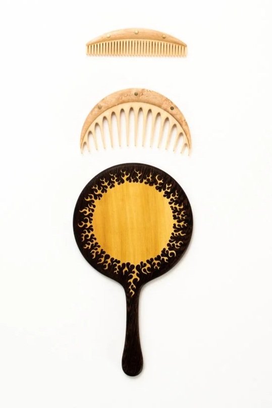 The mirror is inlaid with a complex sun pattern, pulled straight from my sketchbook.