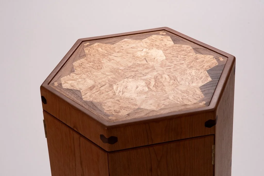 The cabinet has a strong geometric heirarchy, with all elements having a unified language.