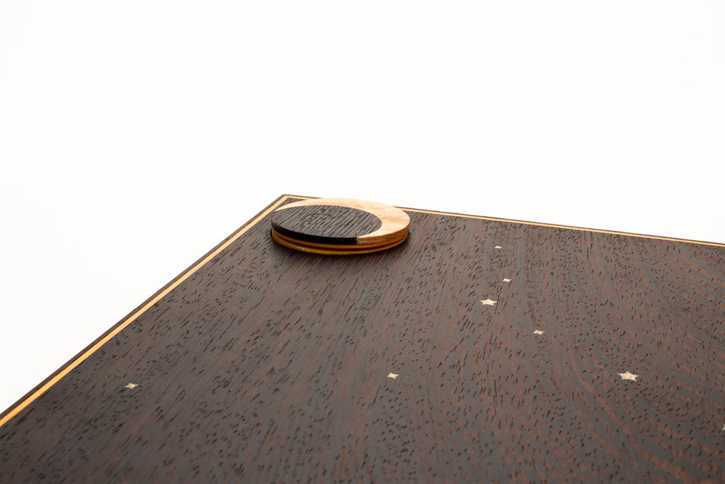 A secret compartment reveals itself, with something hidden inside...
