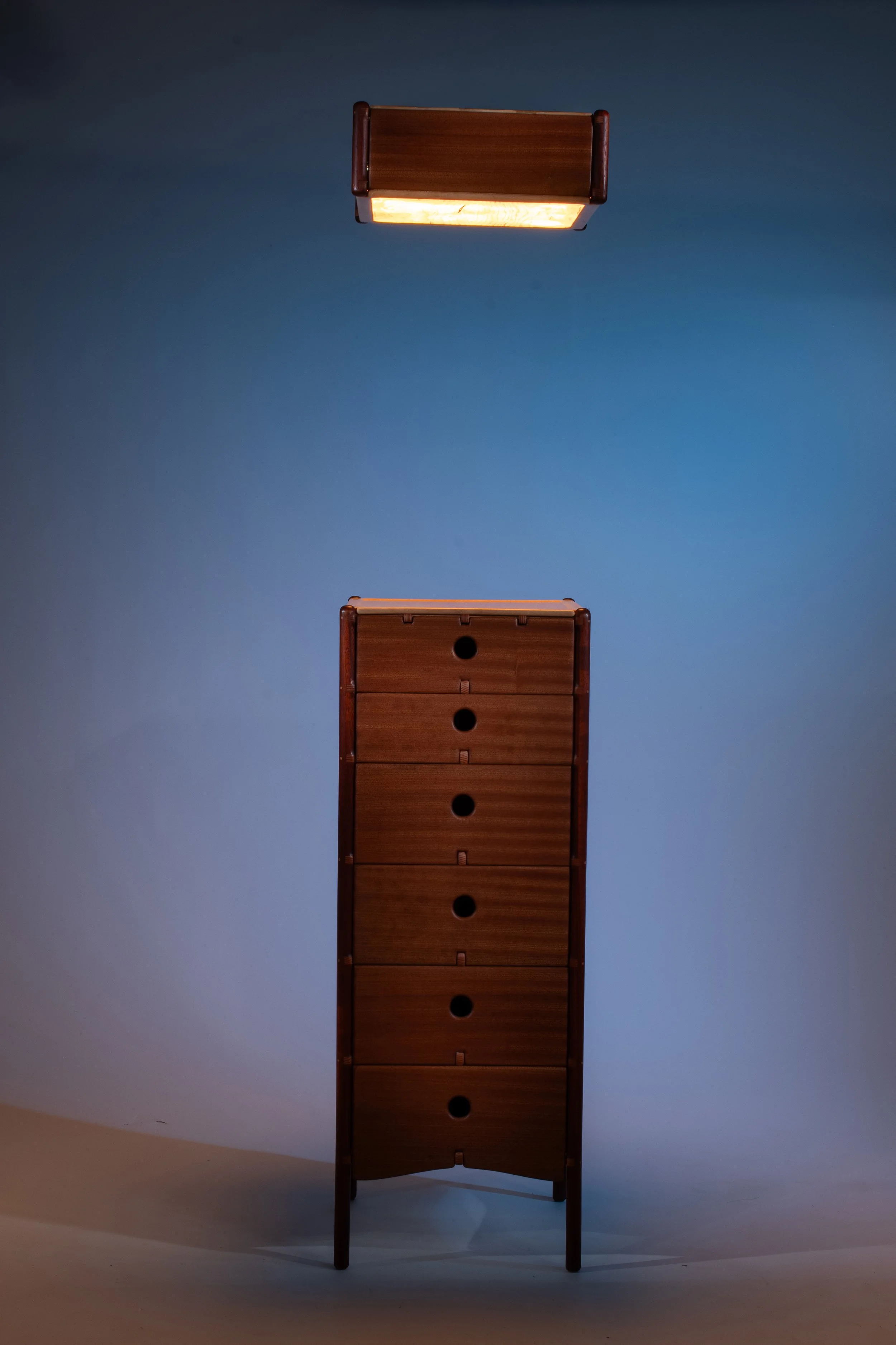 The side table and lamp are made using the same design language, creating a cohesive pair. 