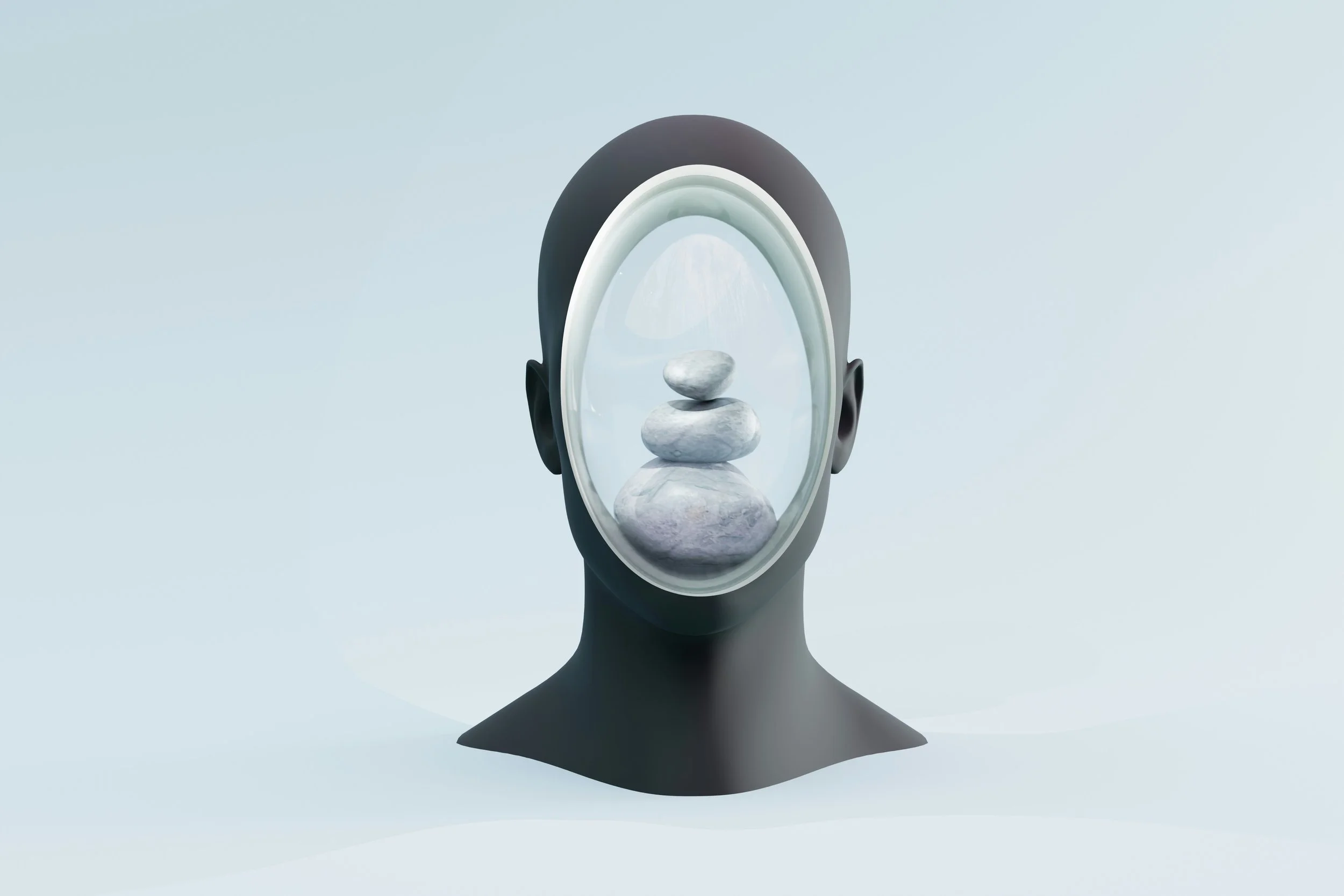 A mannequin head with a mirror on its face, reflecting a stack of three white stones.