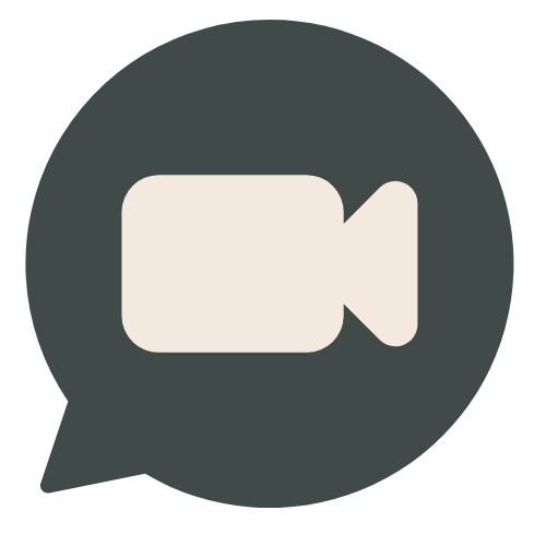 Icon of a video camera inside a speech bubble, representing video communication or video chat.