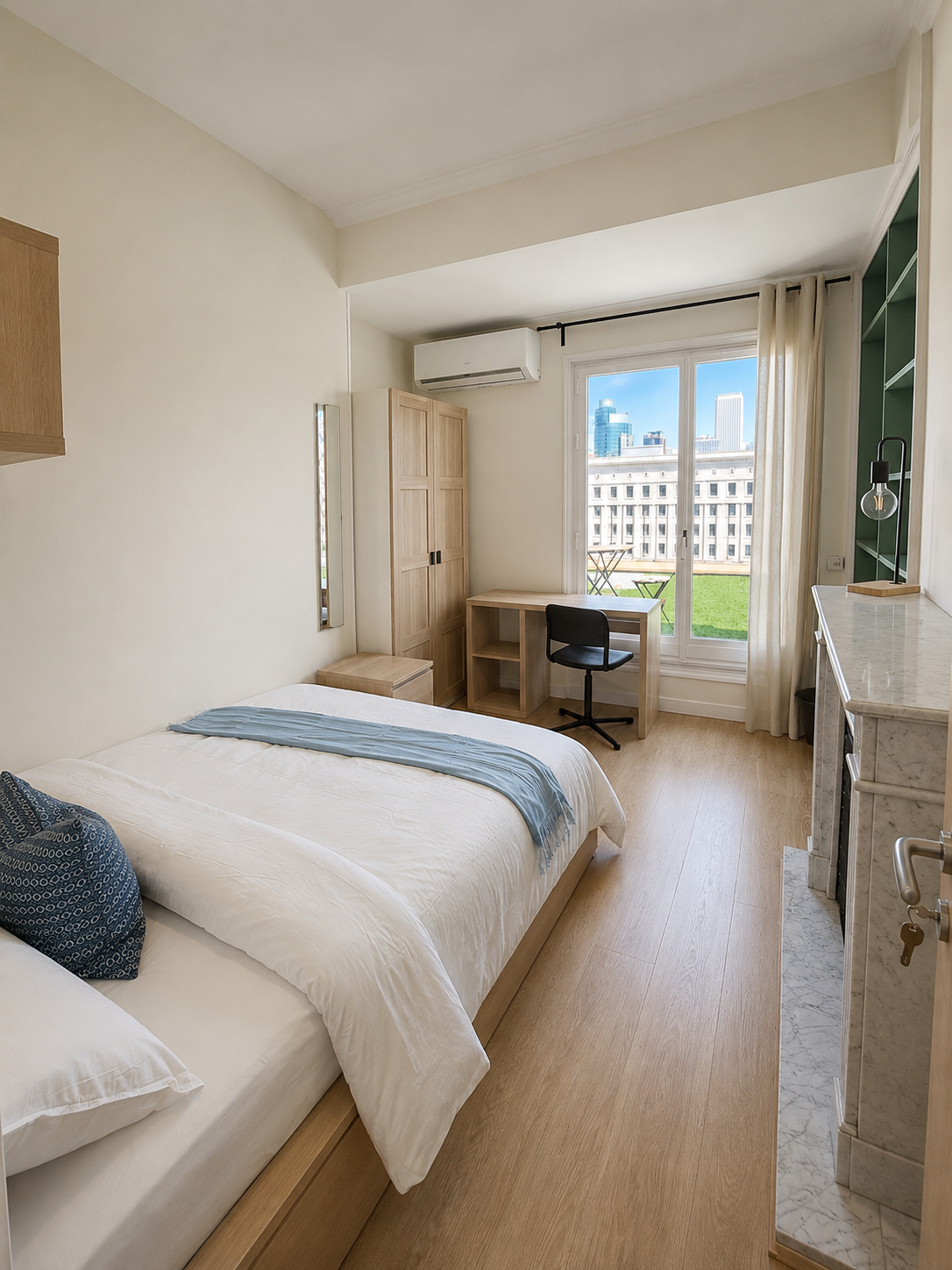 A contemporary hotel room with a white bed, wooden furniture, a small desk and black chair near a large window with an outdoor view.