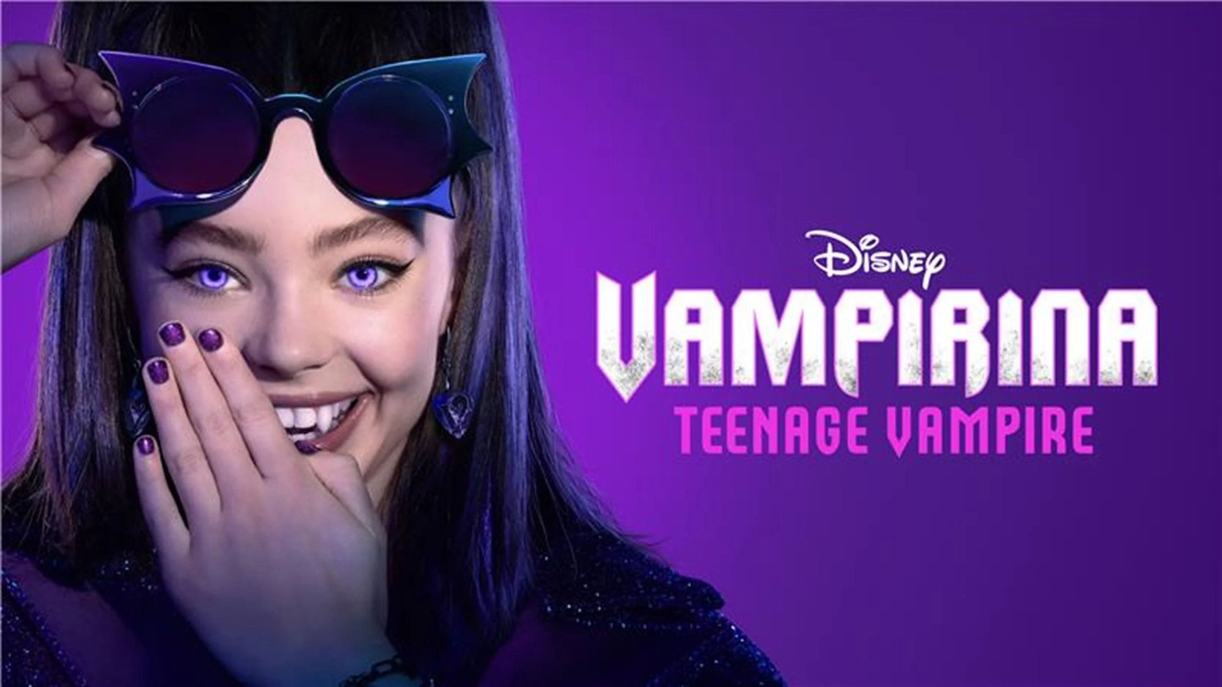 Close-up of a young girl with purple eyes and dark hair, wearing vampire-themed sunglasses shaped like bat wings, smiling with her hand covering part of her face, with a purple background and the text 'Disney Vampirina Teenage Vampire'.