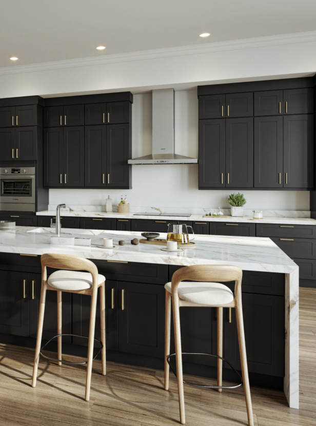 Modern kitchen with black cabinetry, white marble countertops, two wooden barstools, and stainless steel appliances.