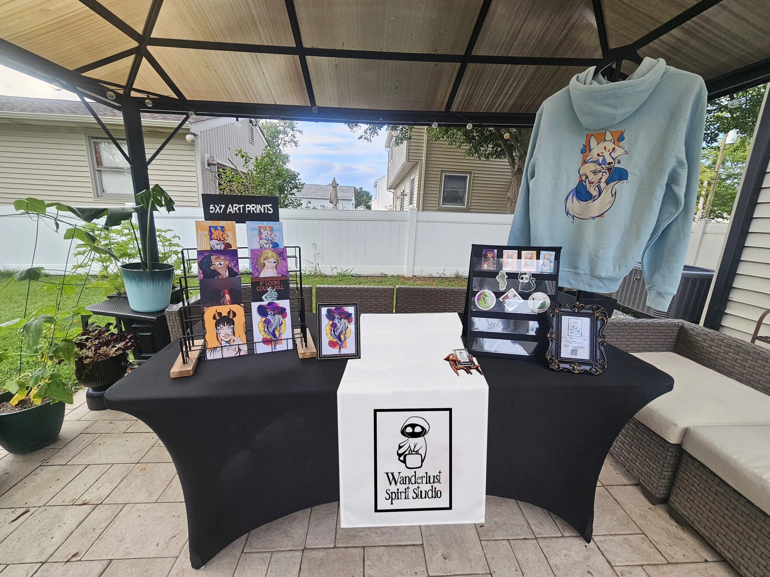 Art and apparel vendor booth for Wanderlust Spirit Studio