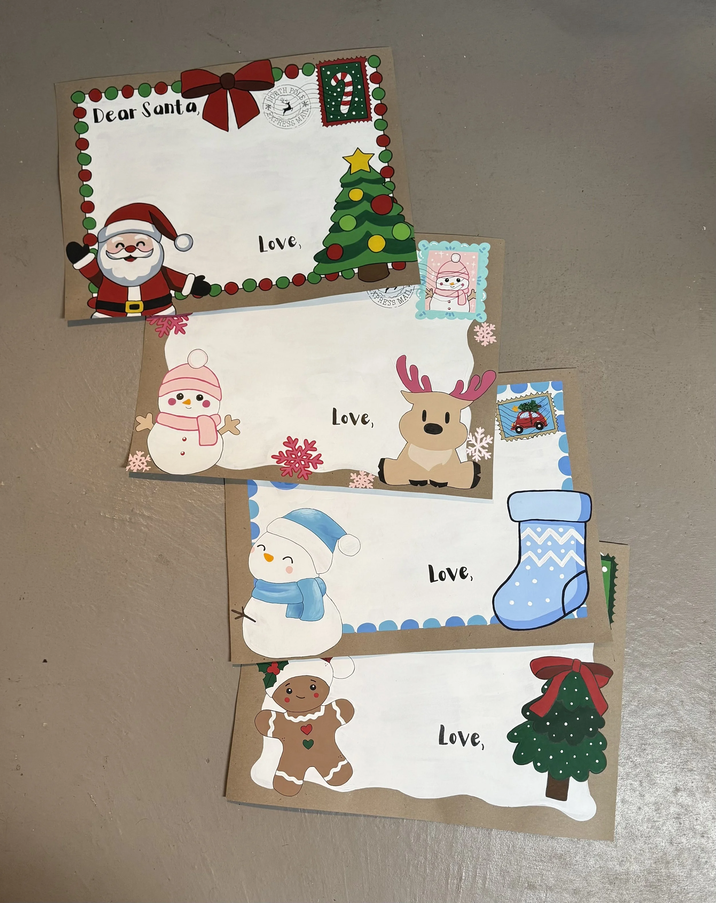 Colorful Christmas cards with illustrations of Santa Claus, snowmen, reindeer, Christmas trees, and holiday decorations, with handwritten words 'Dear Santa,' and 'Love,'.