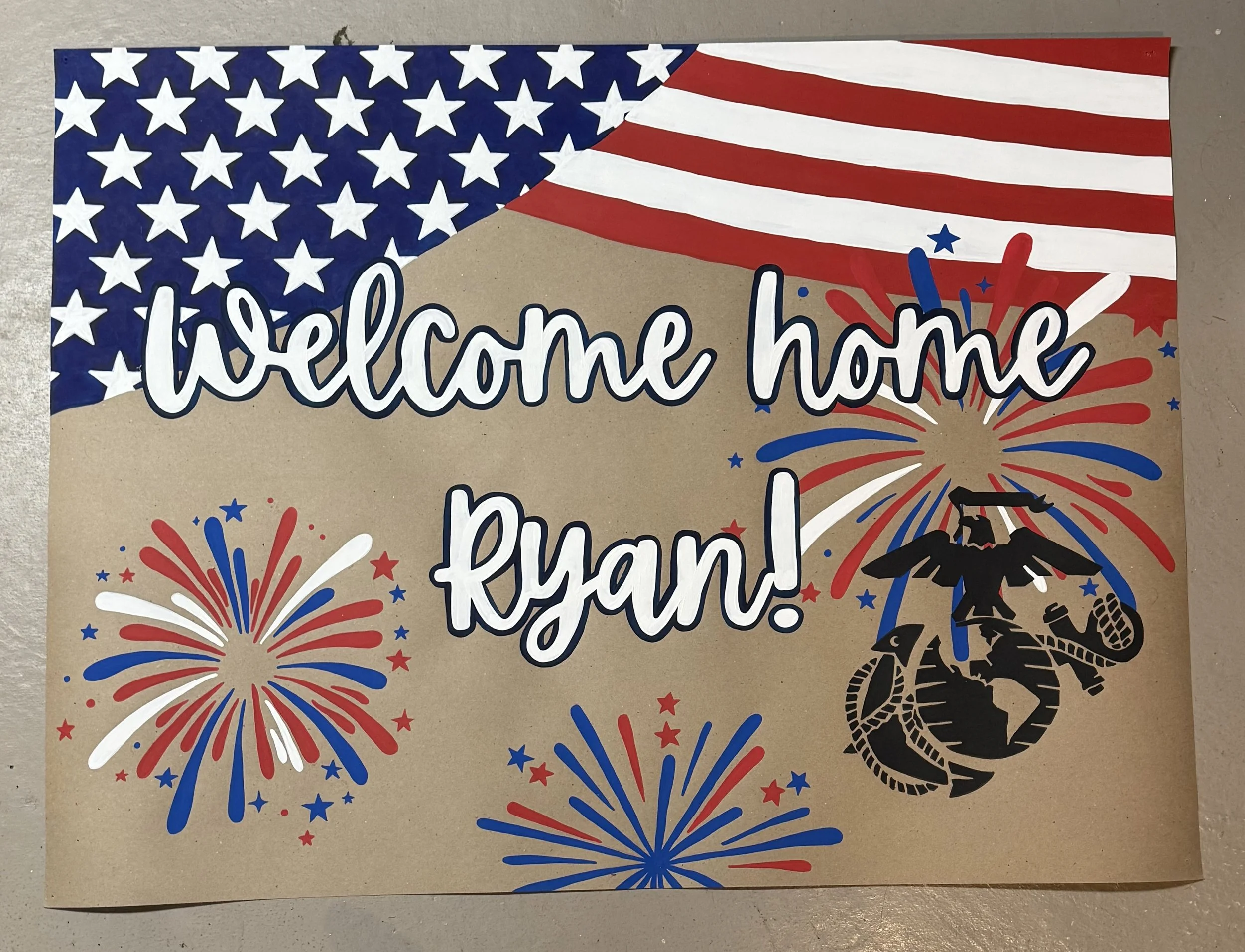 Patriotic poster with an American flag waving, surrounded by fireworks and a black silhouette of a soldier with a rifle. The text 'Welcome home my brave' is written prominently in white, cursive font.