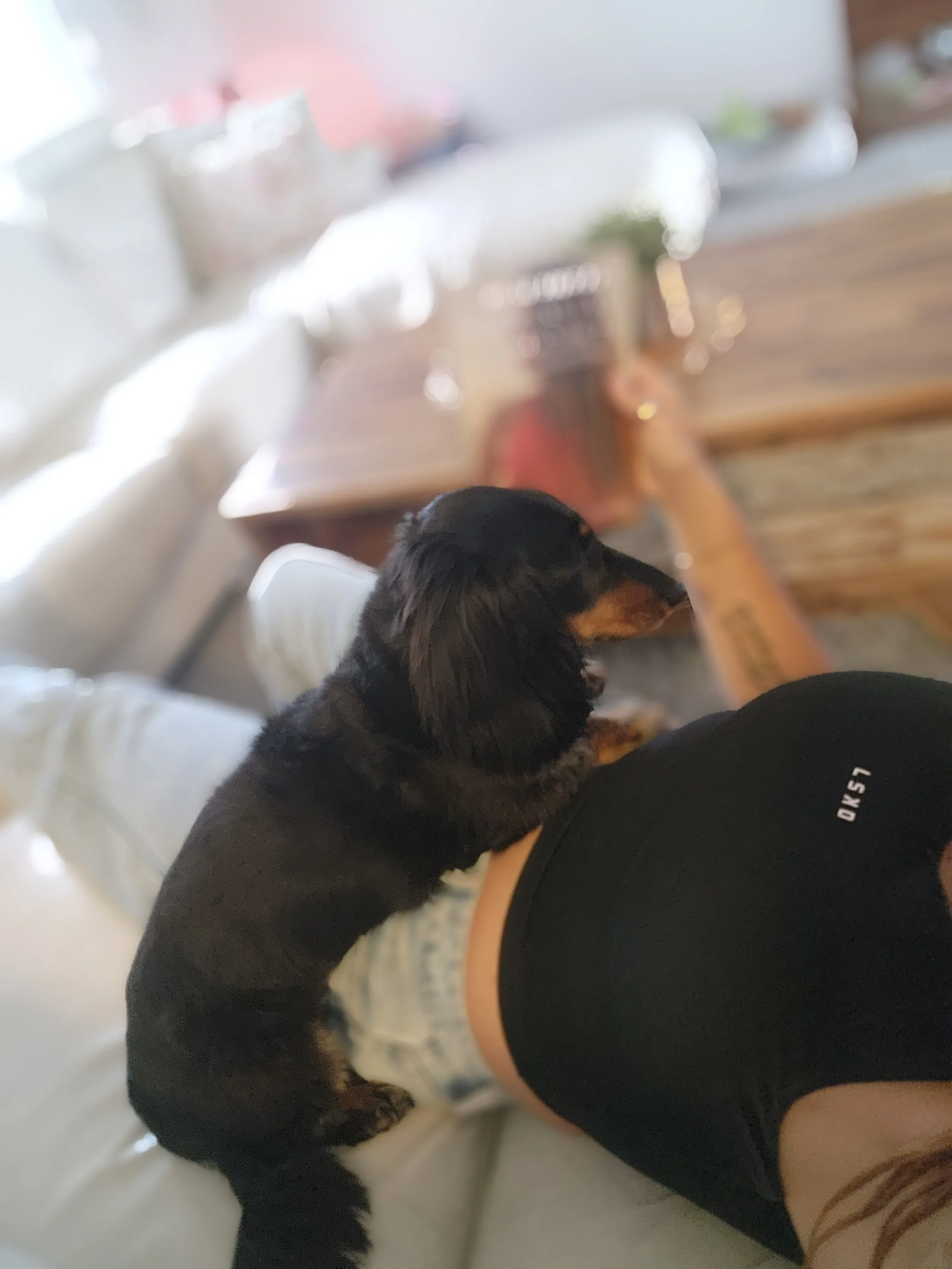 Yasmin Wheatley relaxing at home with her dog.