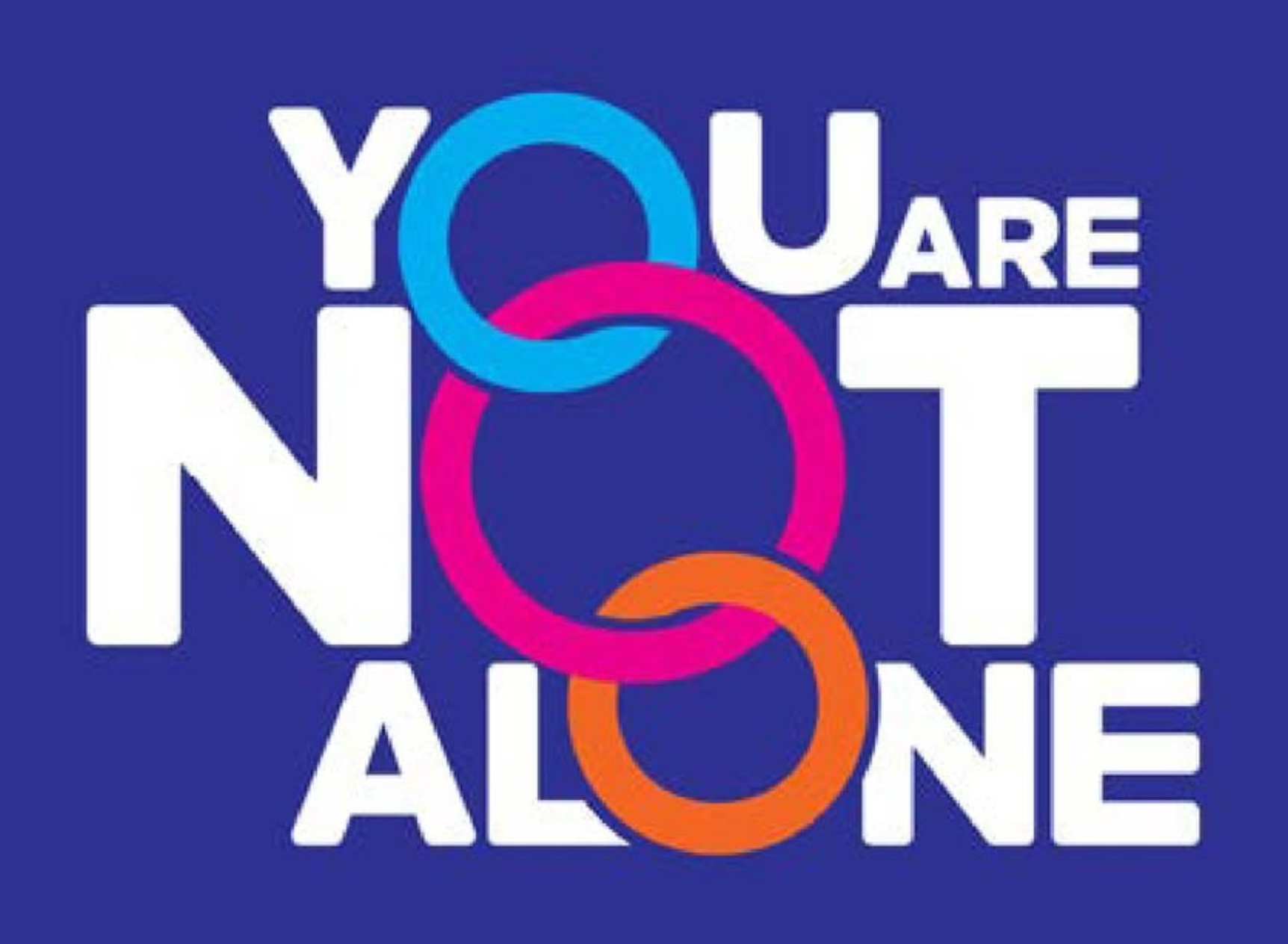 The image contains the phrase 'You are not alone' with colorful interconnected rings on a dark blue background.