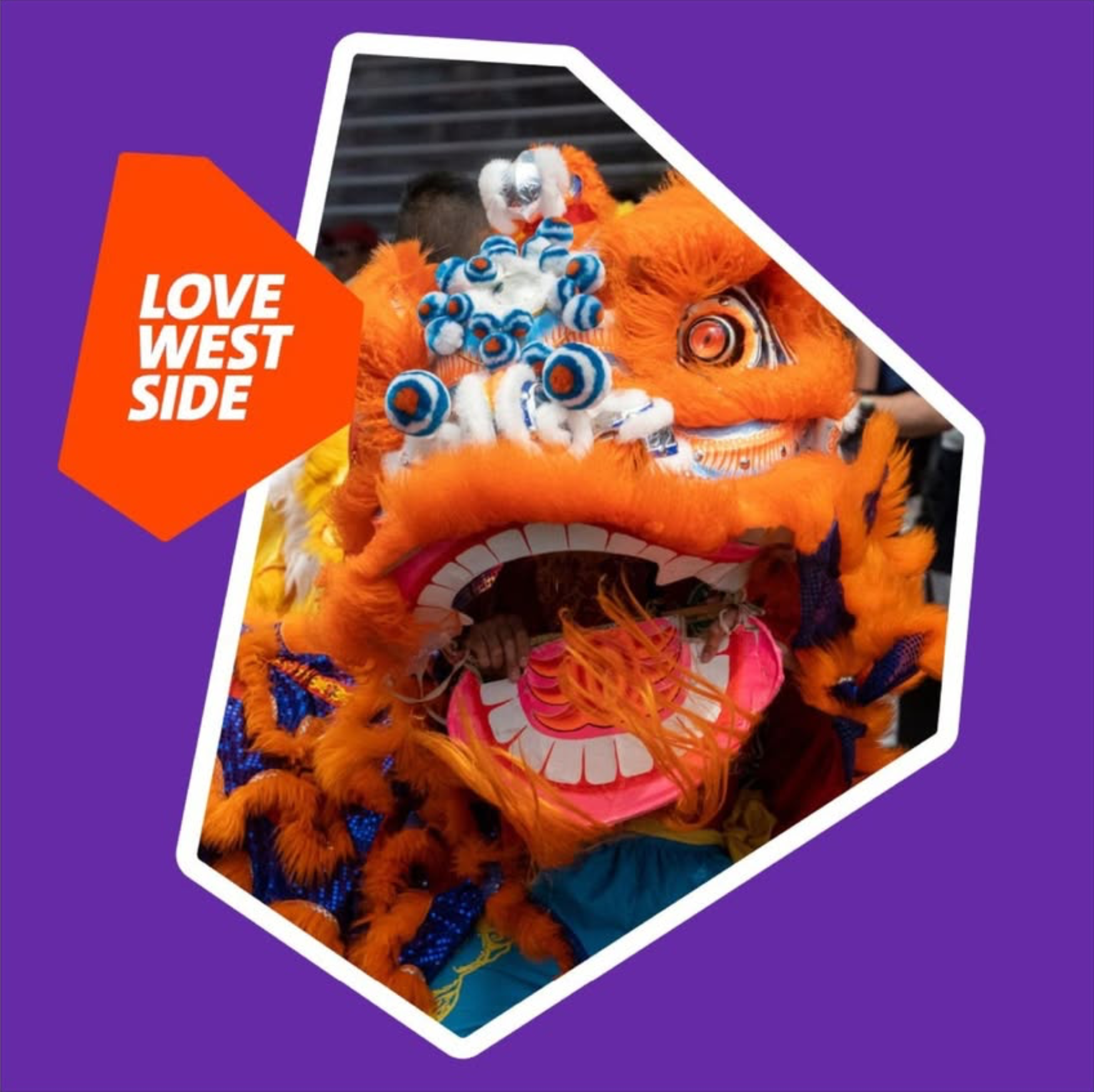 A vibrant Chinese lion dance costume with a large orange furry face, detailed eyes, and a wide mouth, being worn during a celebration, with a person visible in the background.