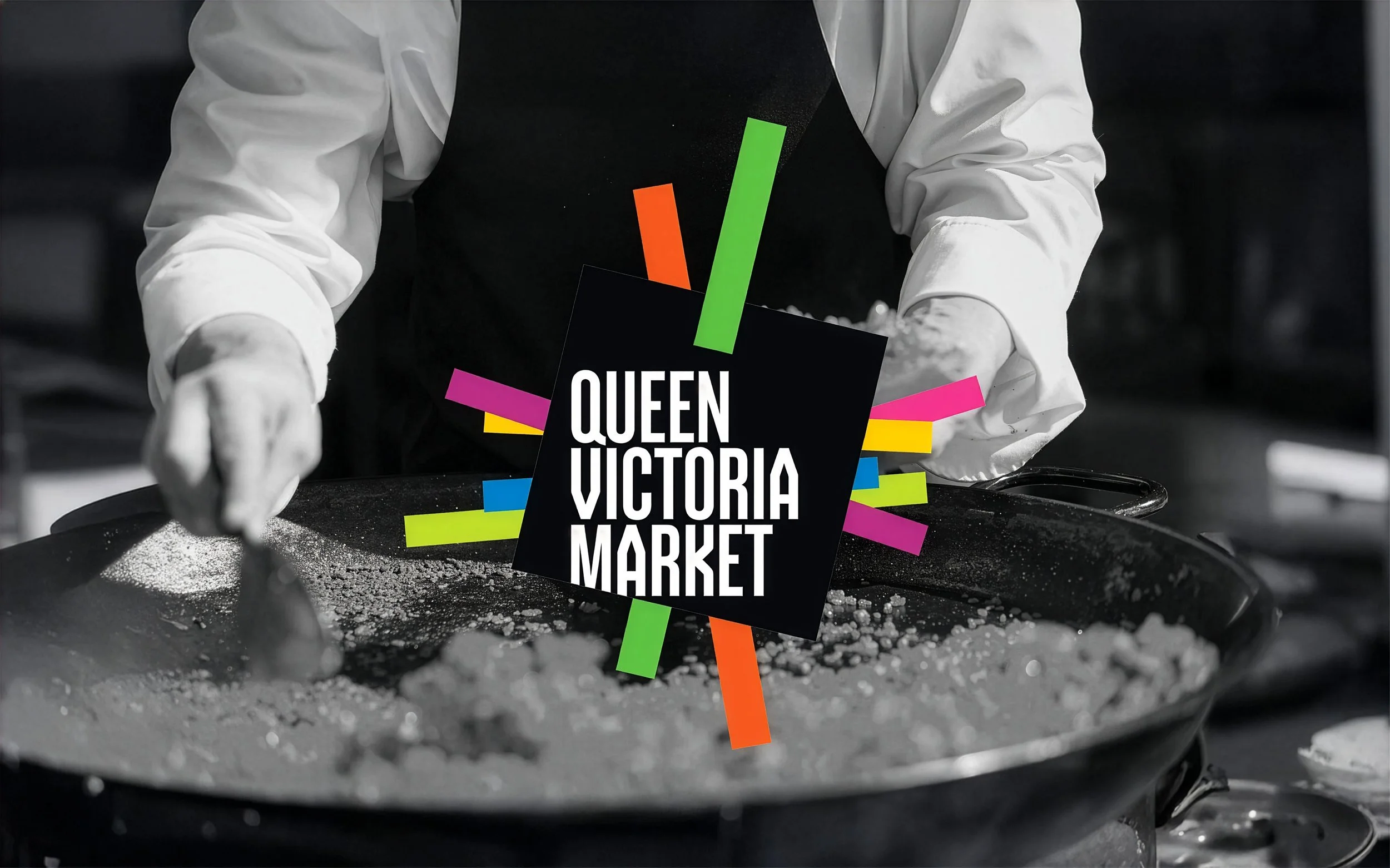 A person in white gloves handling a spatula over a black surface with white powder, with colorful words 'Queen Victoria Market' on the image.