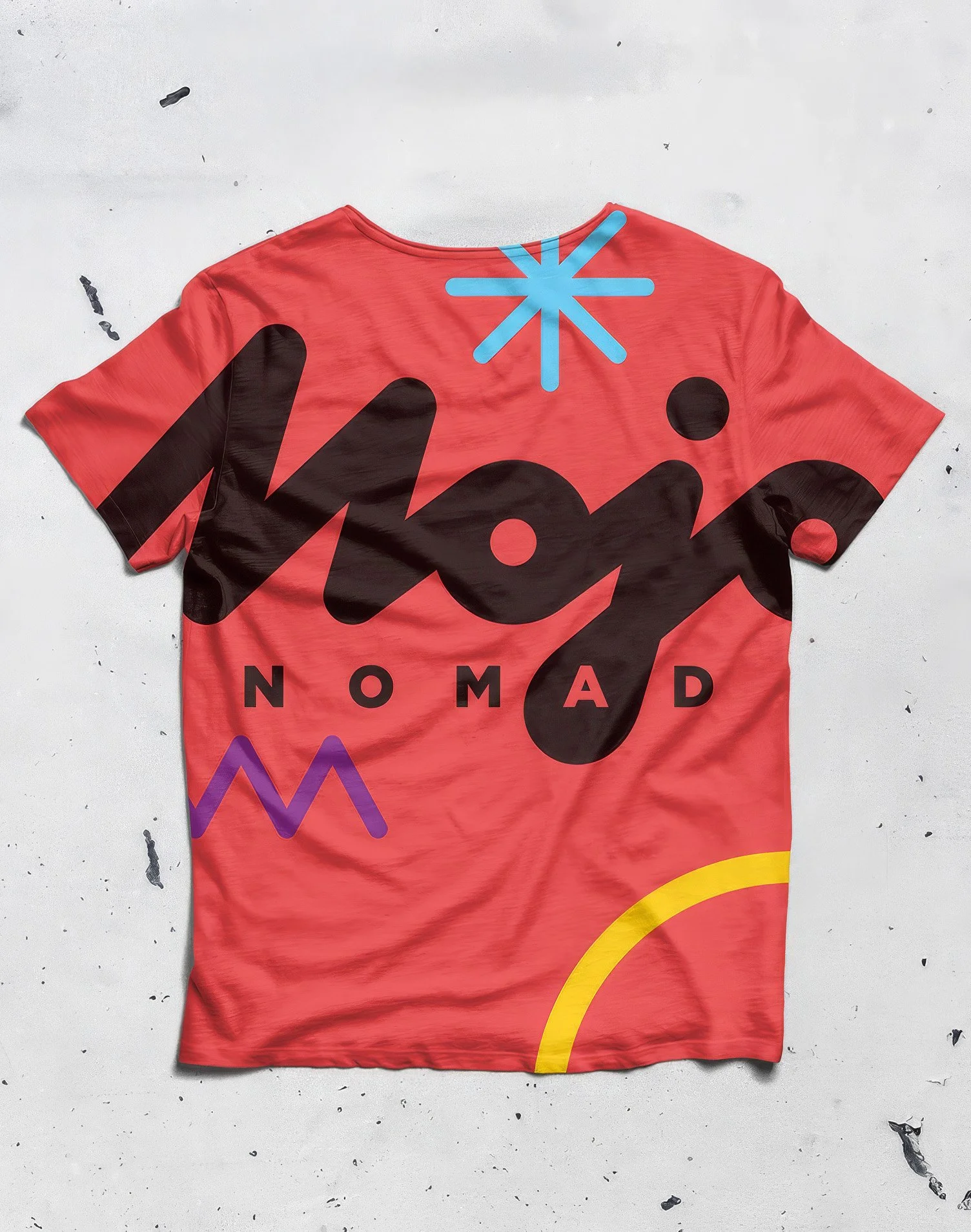 A colorful sports jersey with the words 'NOMAD' and abstract designs in black, blue, purple, and yellow on a red background.