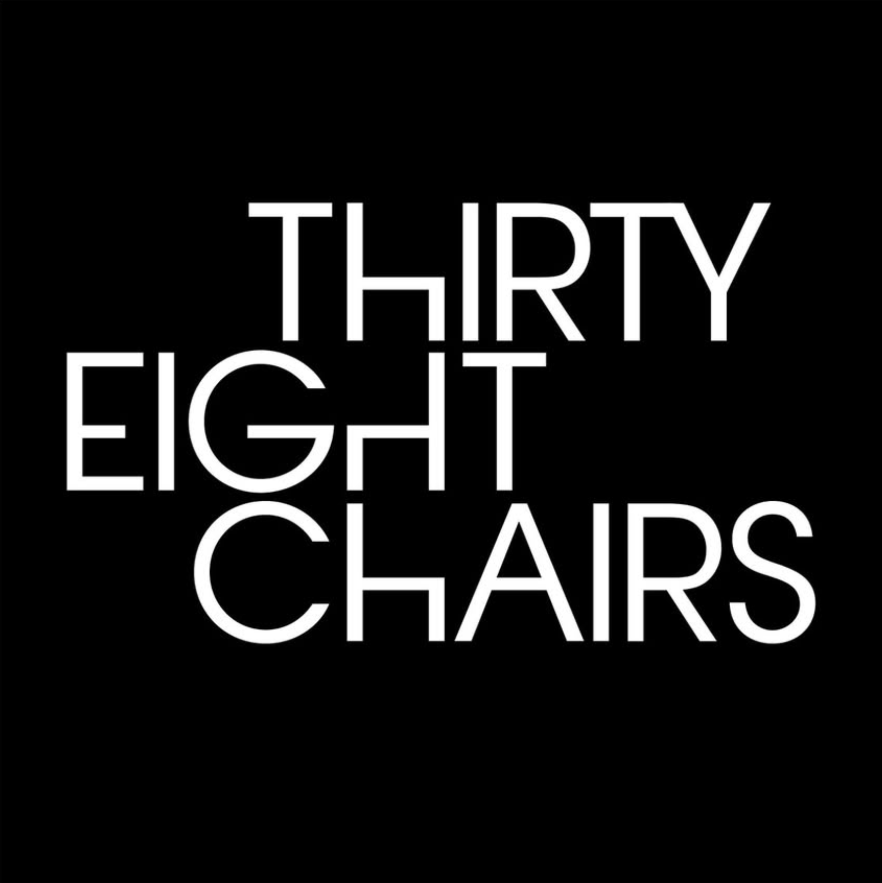 Text graphic with black background and white outlined letters that spell out "THIRY EIGHT IT CLAPS" arranged in a scattered, overlapping manner.