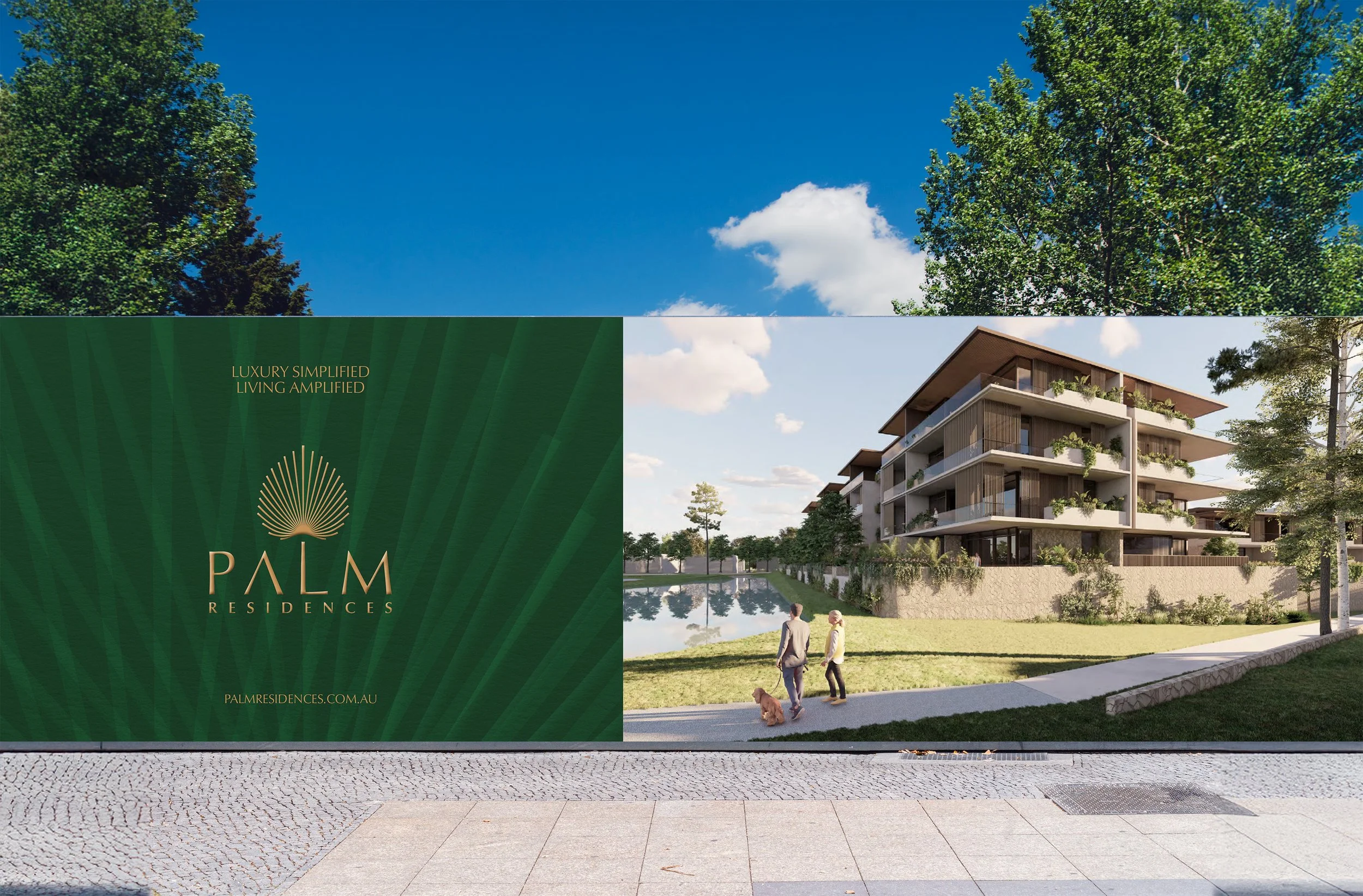 A promotional display and a modern residential building with multiple balconies surrounded by trees, people walking with a dog, and a pond reflecting the sky.