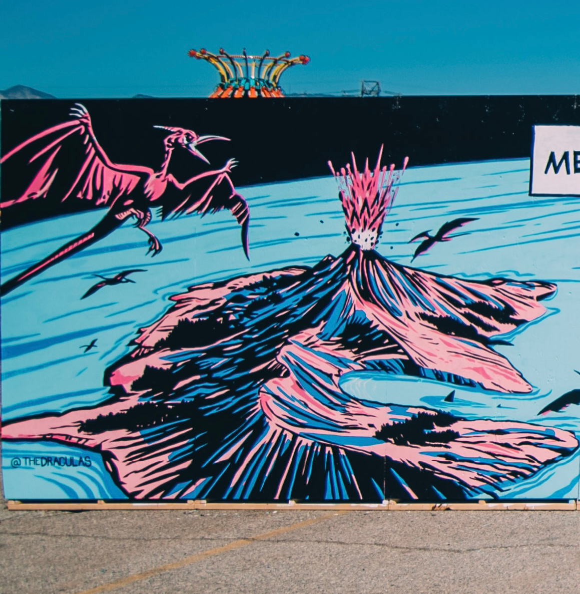 A colorful artwork depicting a dragon flying over a volcanic eruption with pink and black lava, with some birds flying nearby.