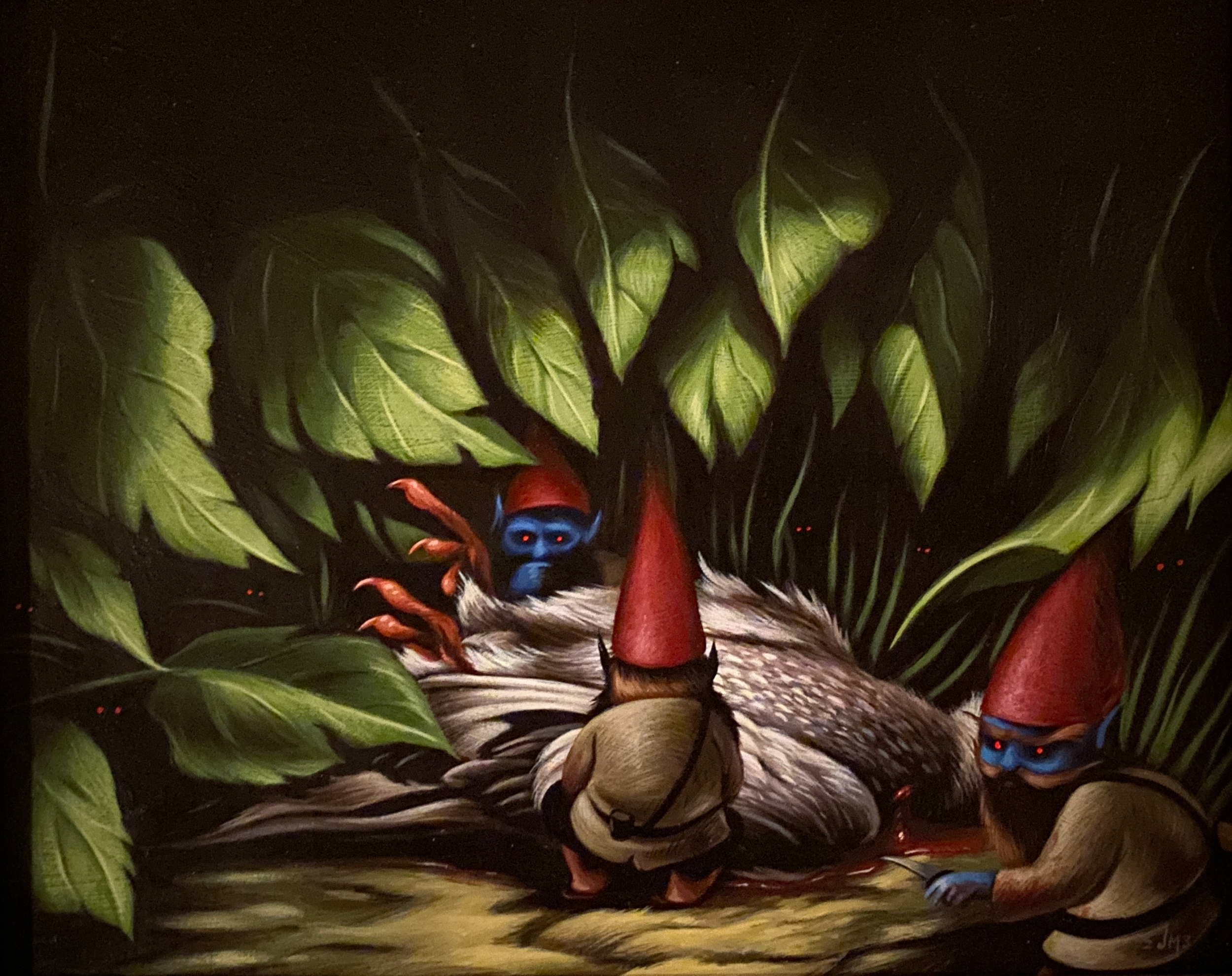Close-up of a colorful bird surrounded by green leaves with red berries, in a dark background.