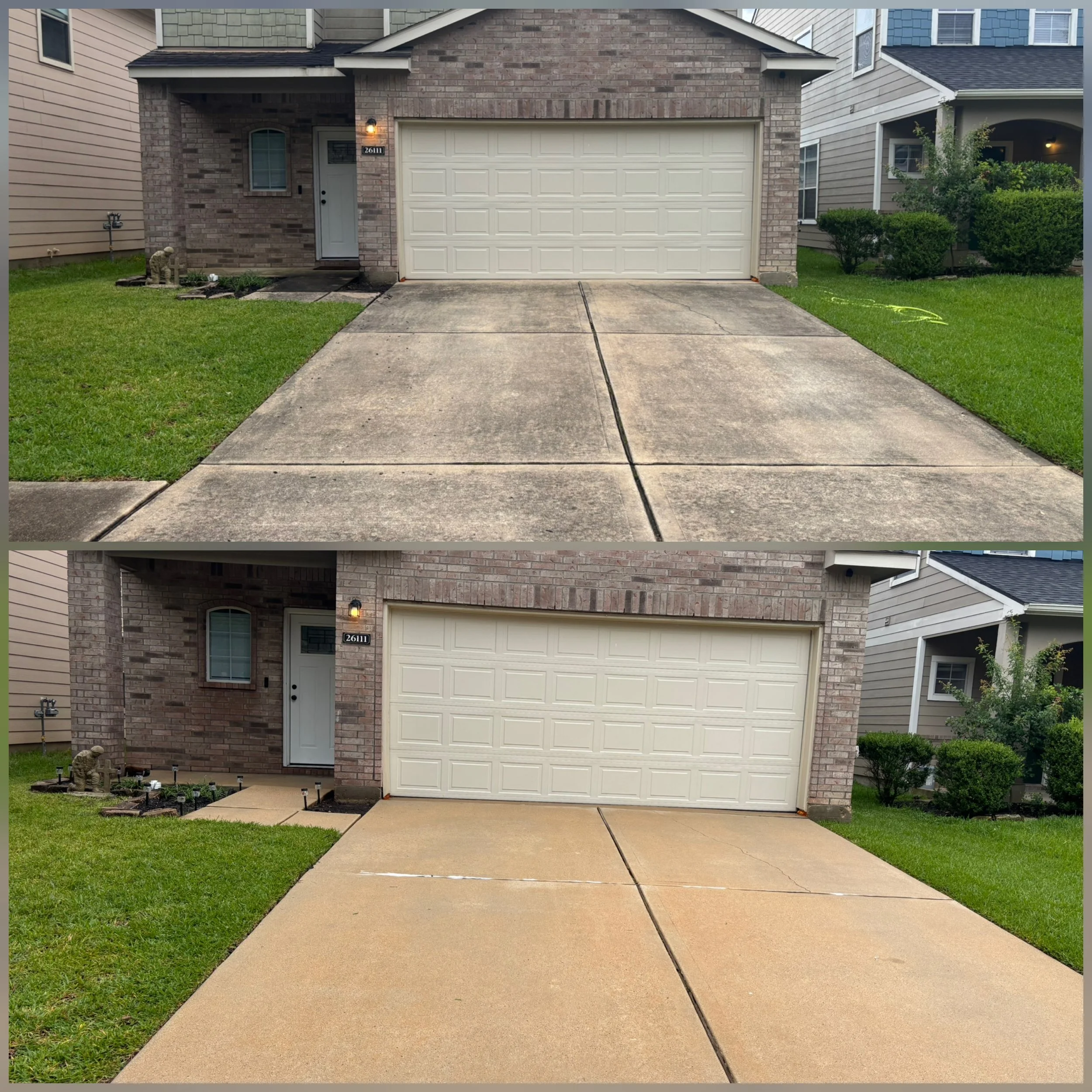 Front view of a residential house with a white garage door, brick facade, and landscaped garden with a statue and plants. Freshly poured concrete driveway and sidewalk are visible.
