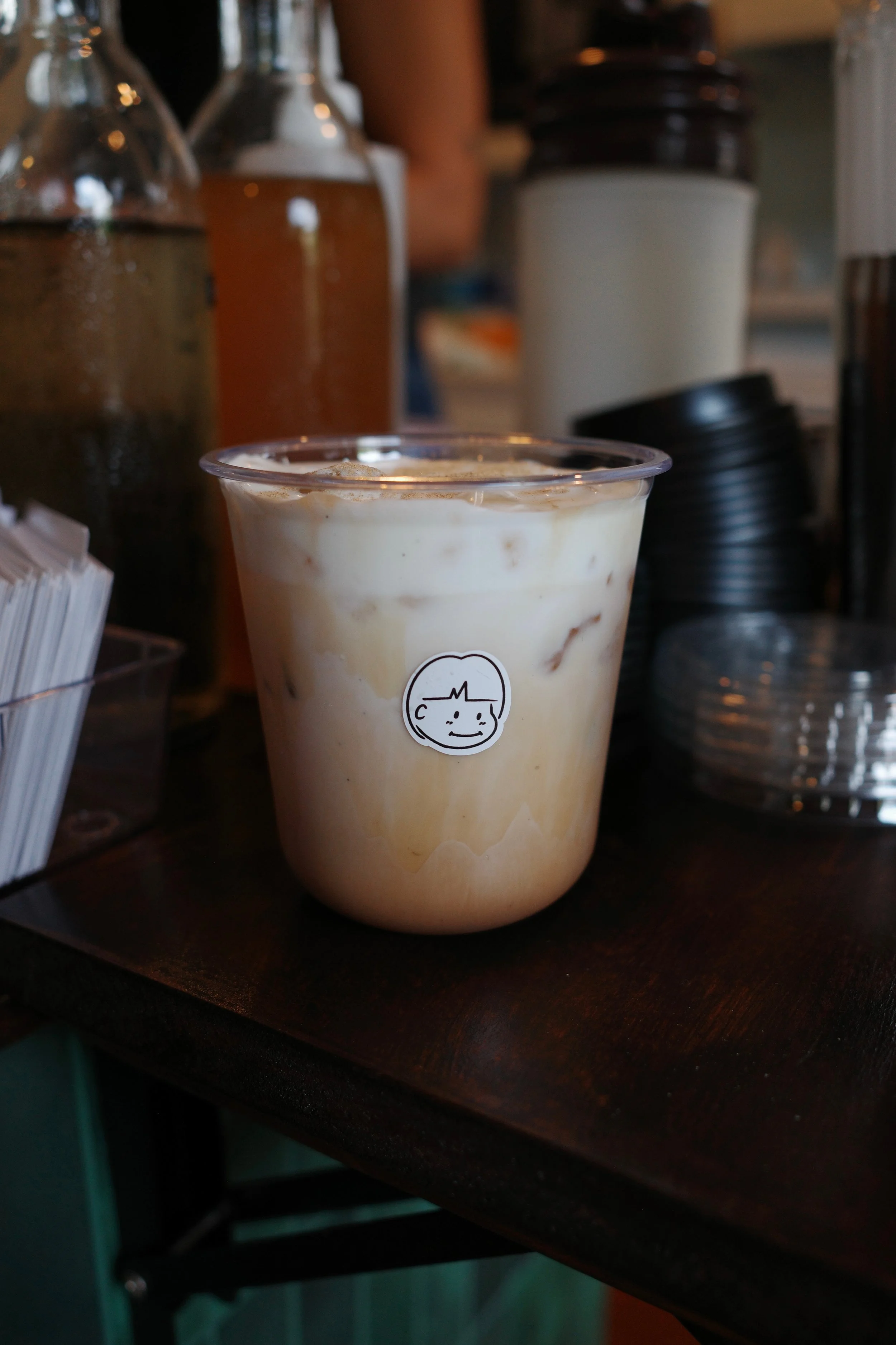 coffee drink with logo sticker on cup