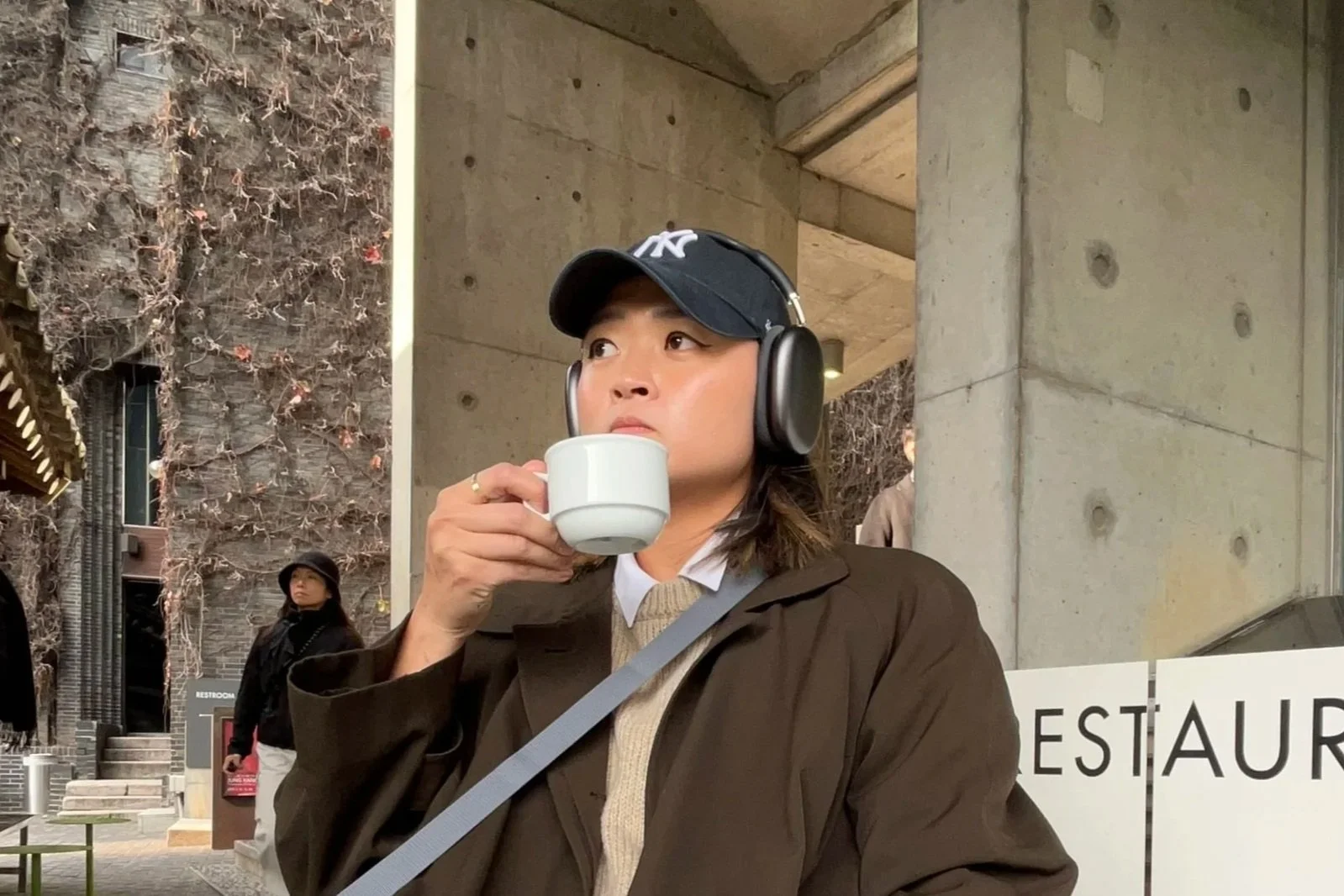 contemplative self photo holding a coffee cup