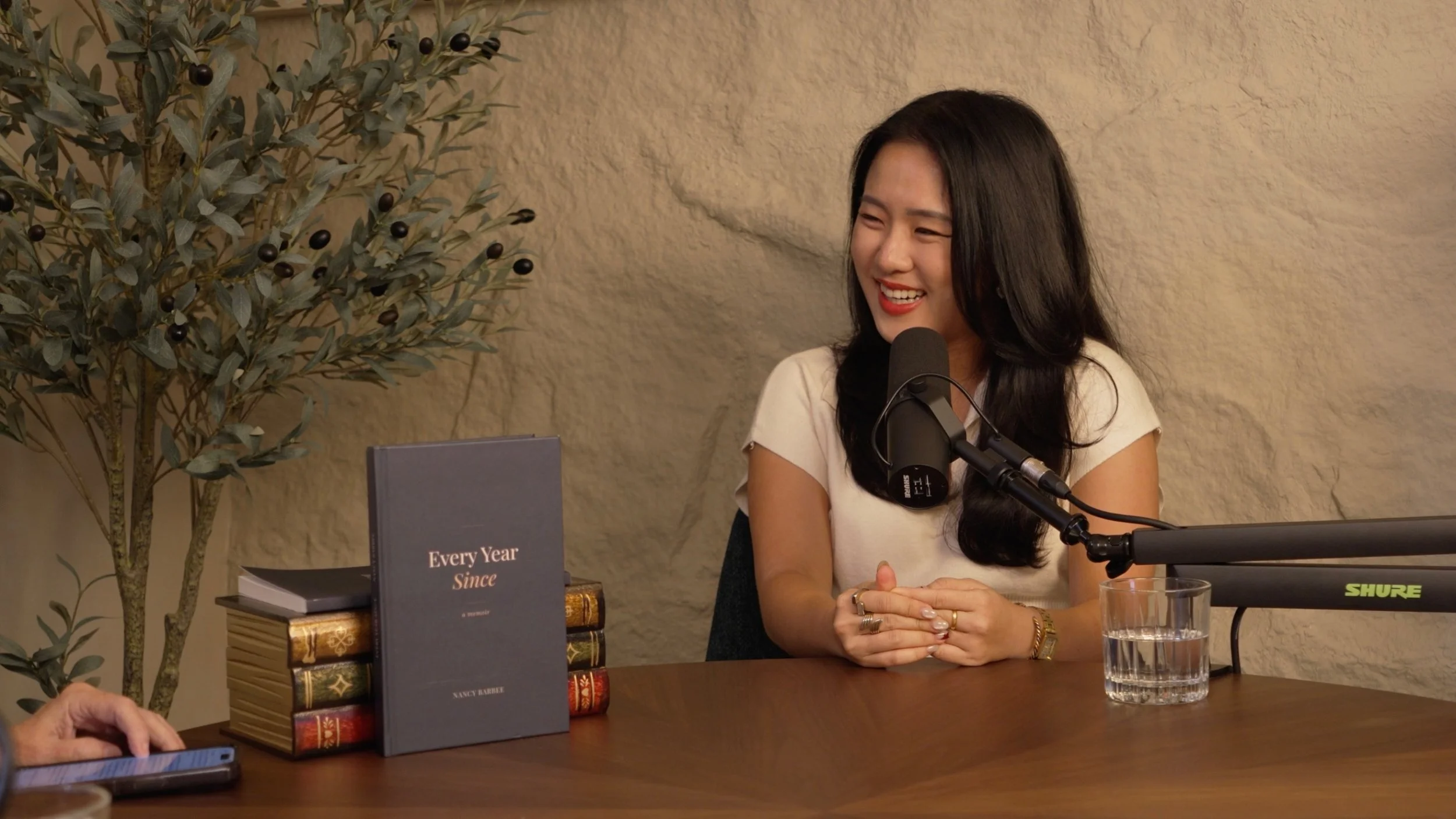 Coach Rae Fung recording a podcast at Studio Analogue