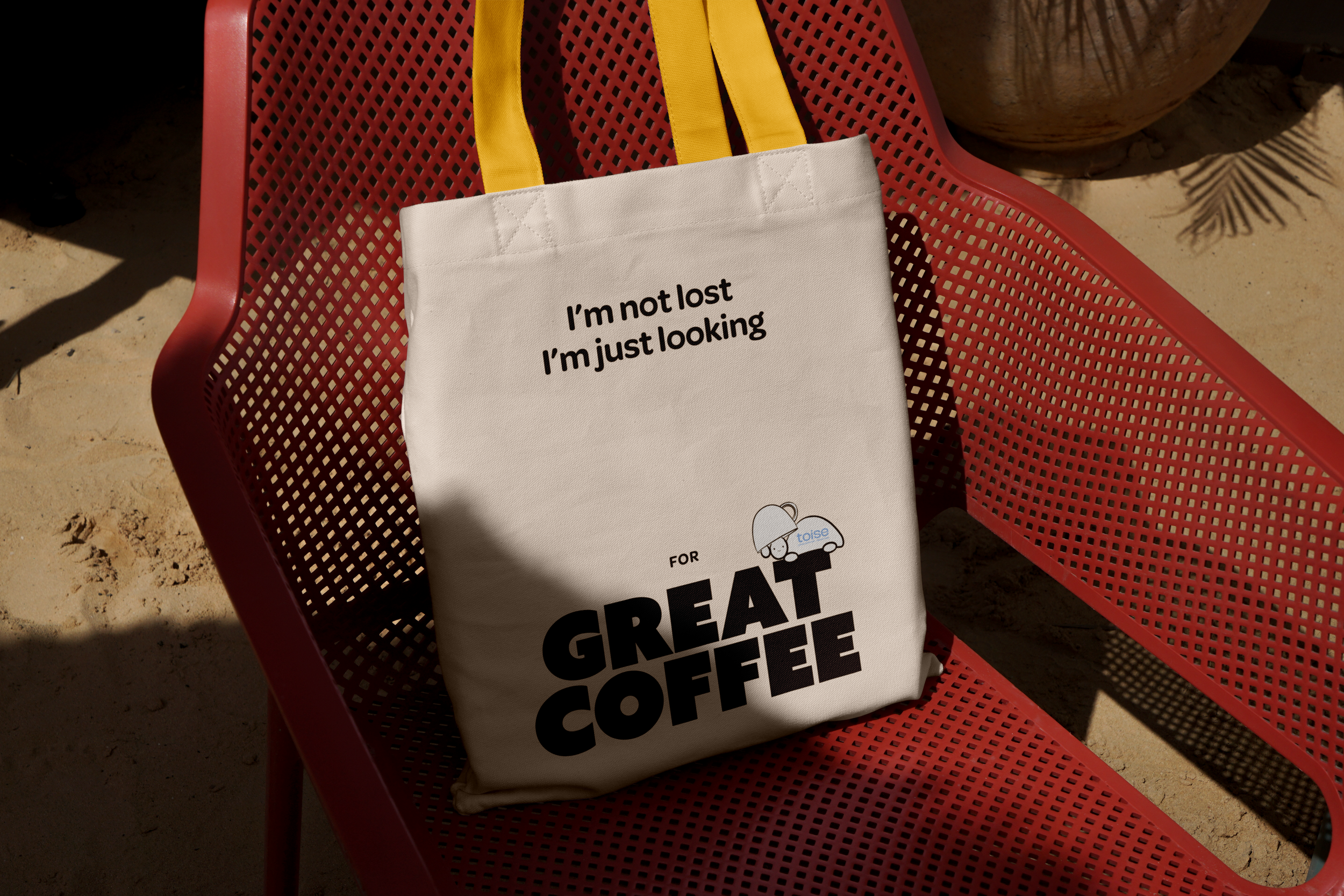 Free Canvas Bag on Plastic Chair Mockup.png