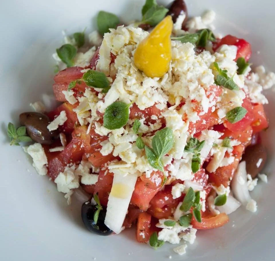 A traditional Greek salad topped with xynomizithra cheese and fresh tomatoes at Baboulas Restaurant.