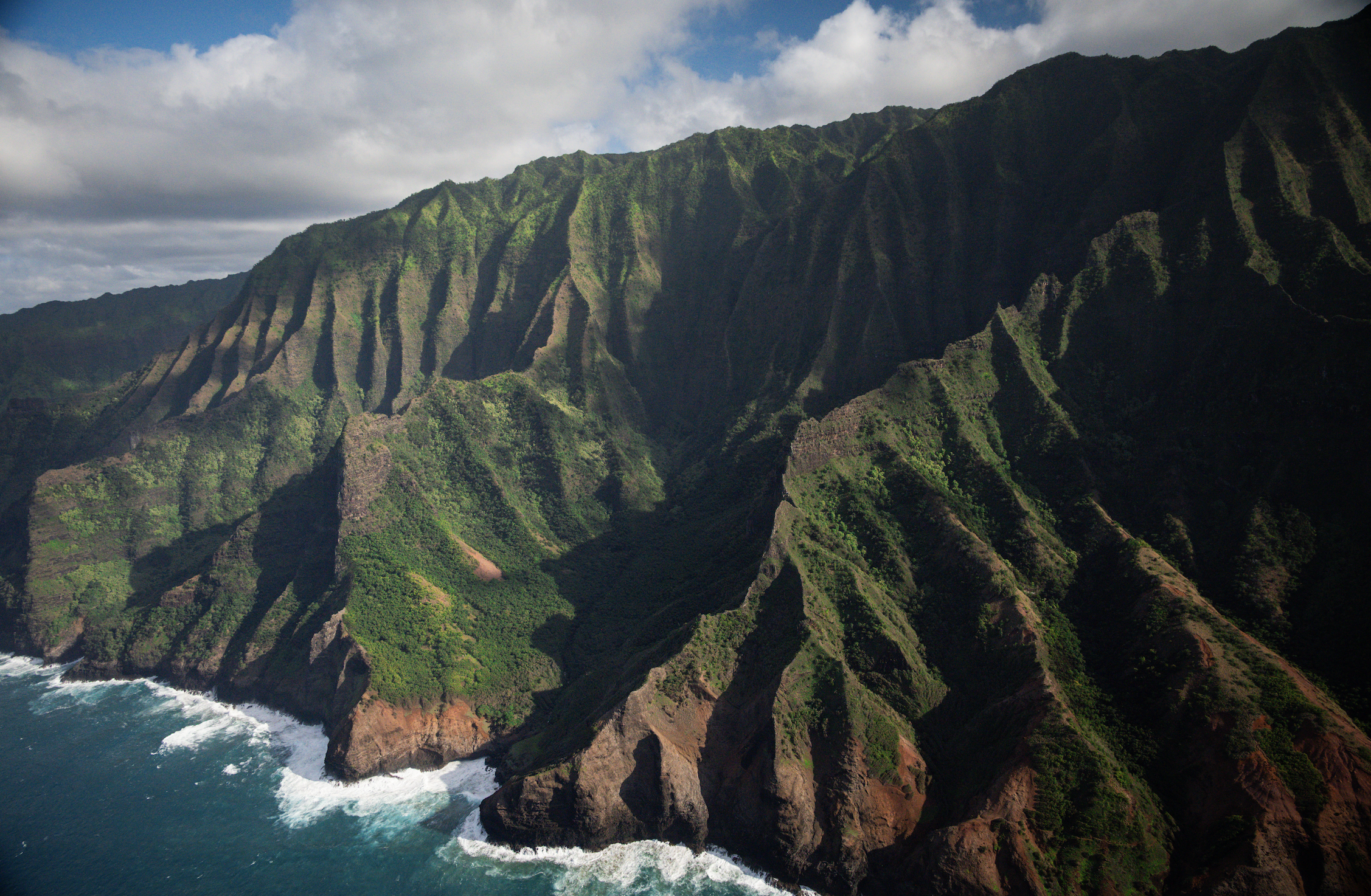 mountains with green moss covering the ridges