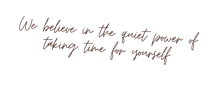 Inspirational quote on a black background with brown cursive text that reads, "We believe in the quiet power of taking time for yourself."