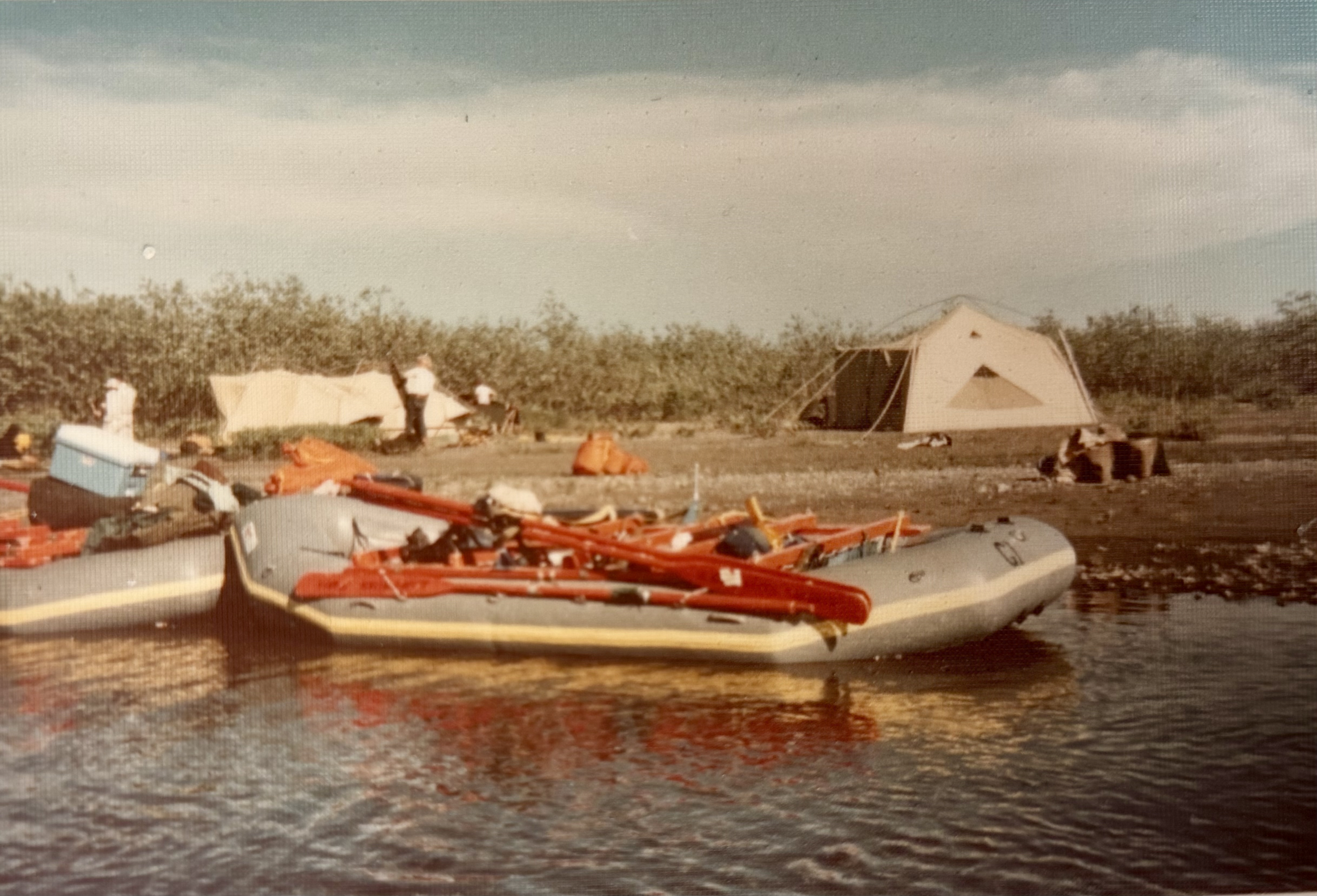 Breaking down camp, heading downriver river to the next campsite..png
