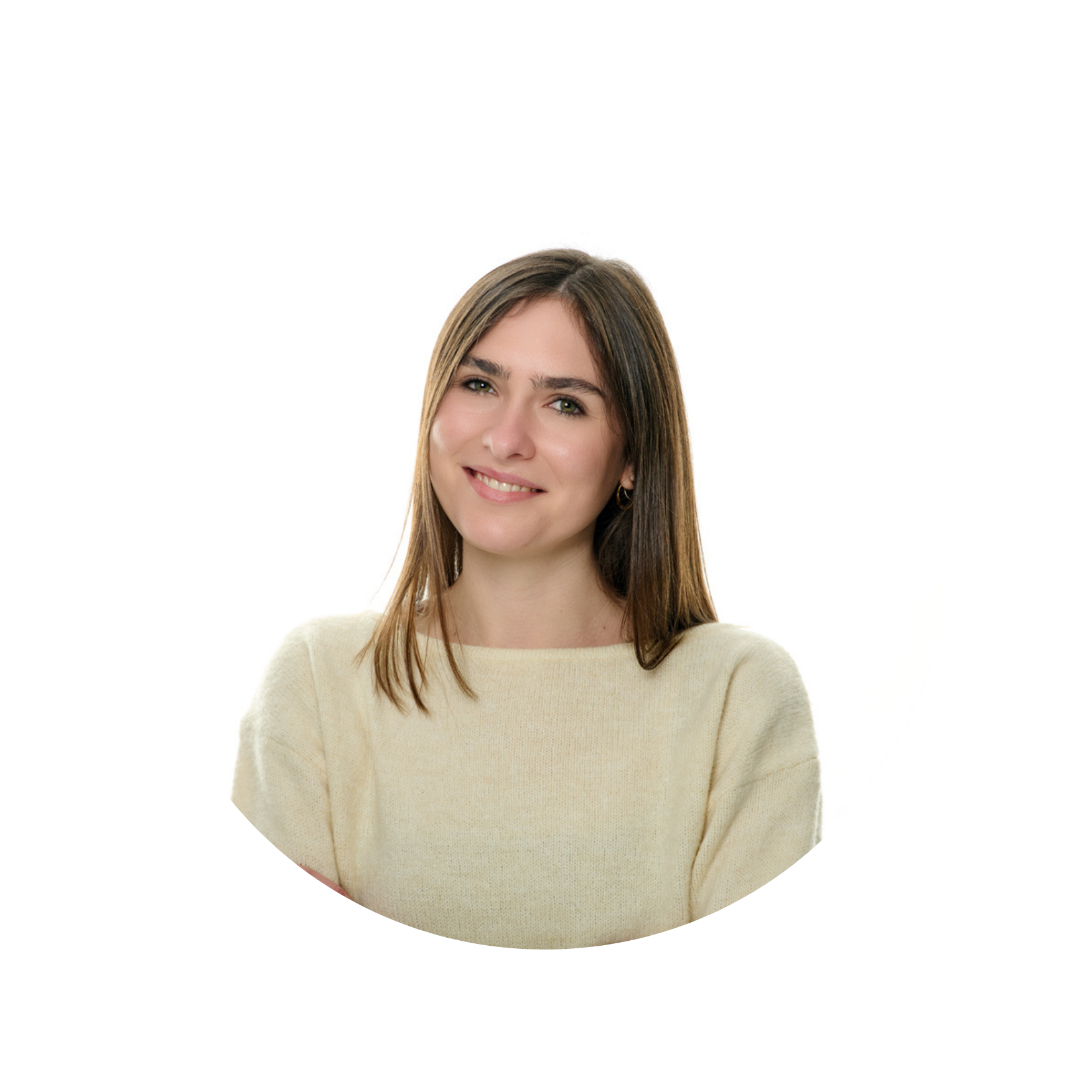 A young woman with long brown hair, wearing a light beige sweater, smiling with crossed arms against a white background.