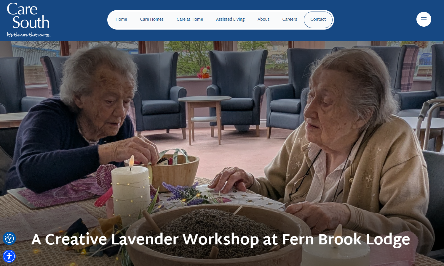 Screenshot of Care South website showing two elderly women with grey hair sat at a table with fabrics, lavender seeds in a wood bowl and a candle in a spacious room with blue arm chairs in the background